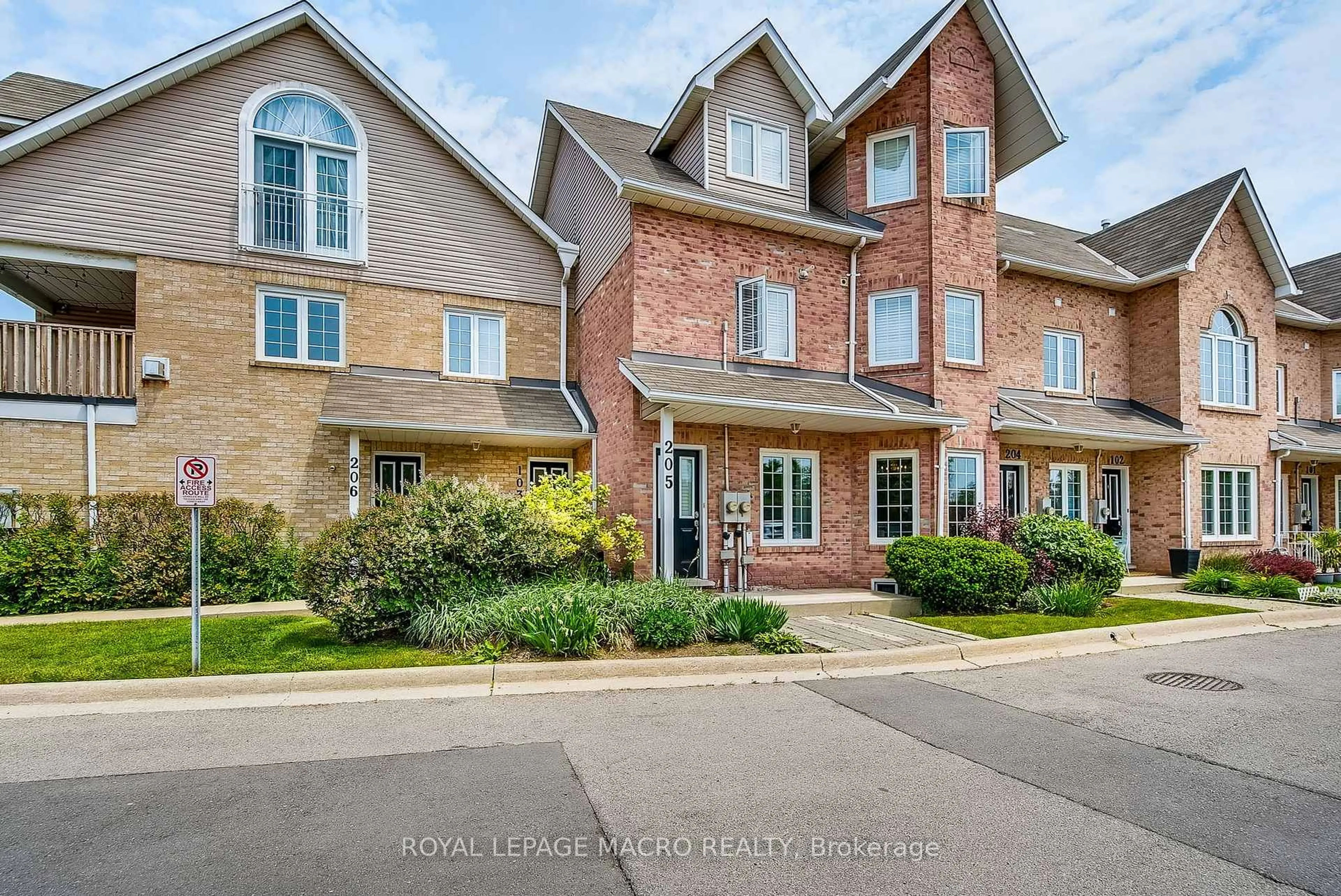 Home with brick exterior material, street for 2055 Walkers Line #103, Burlington Ontario L7M 4B5