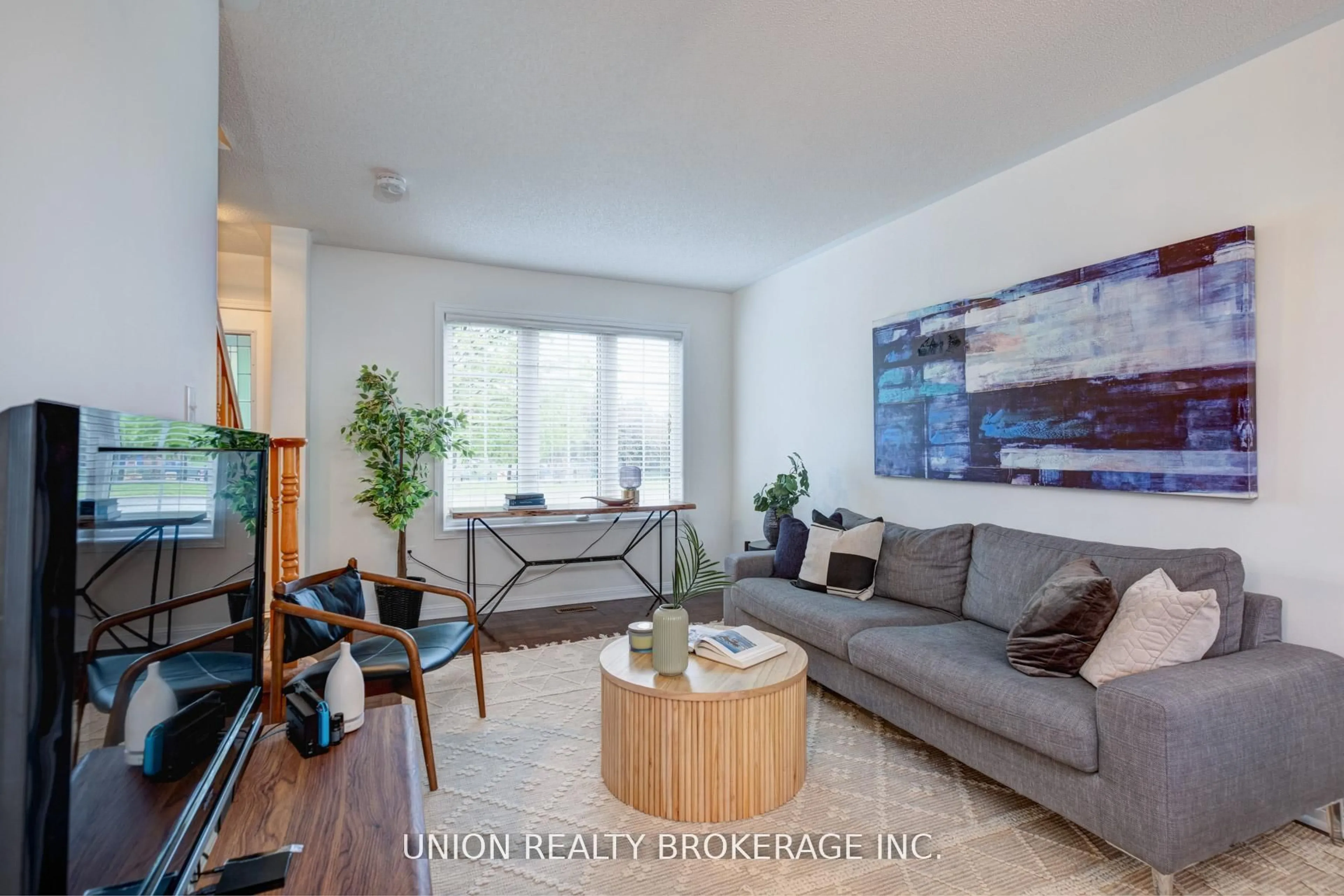 Living room with furniture, wood/laminate floor for 84 Worthington Ave, Brampton Ontario L7A 1N9