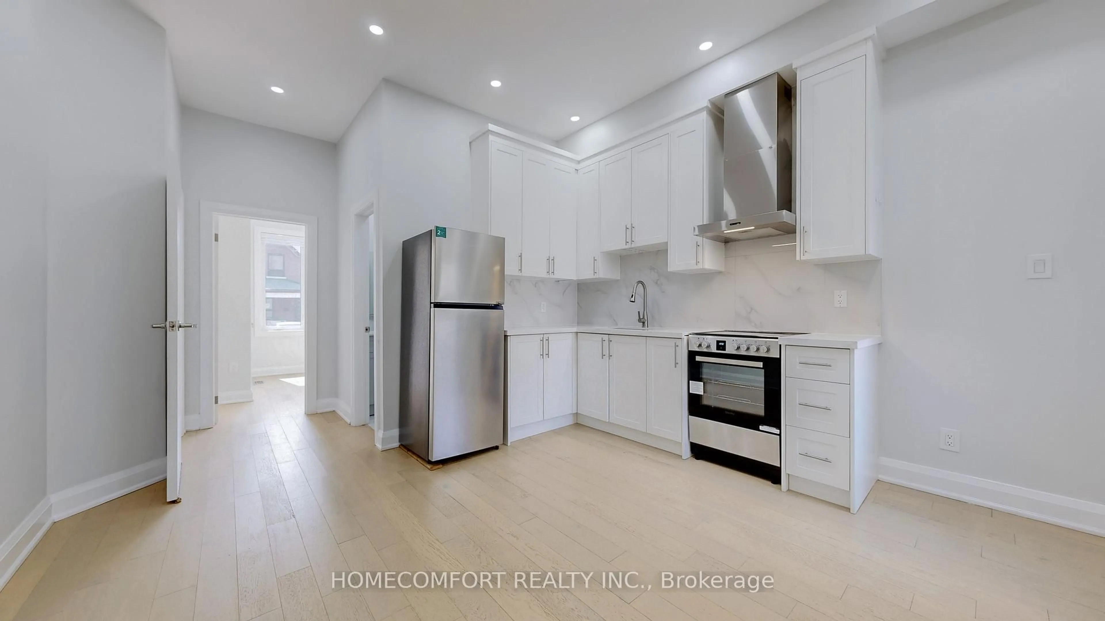 Open concept kitchen, ceramic/tile floor for 217 Osler St, Toronto Ontario M6N 2Z2