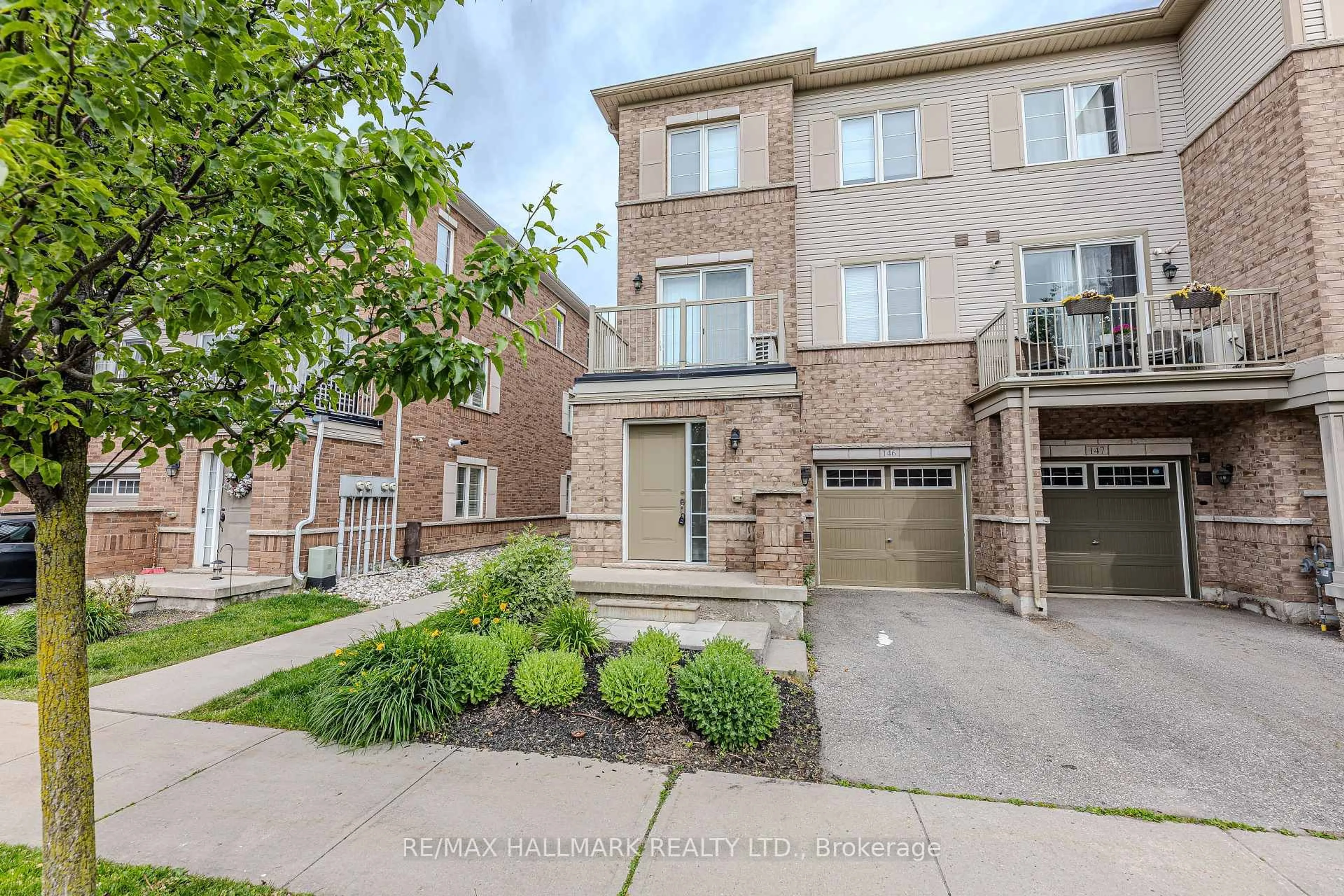Home with brick exterior material, street for 165 Hampshire Way #146, Milton Ontario L9T 8M7