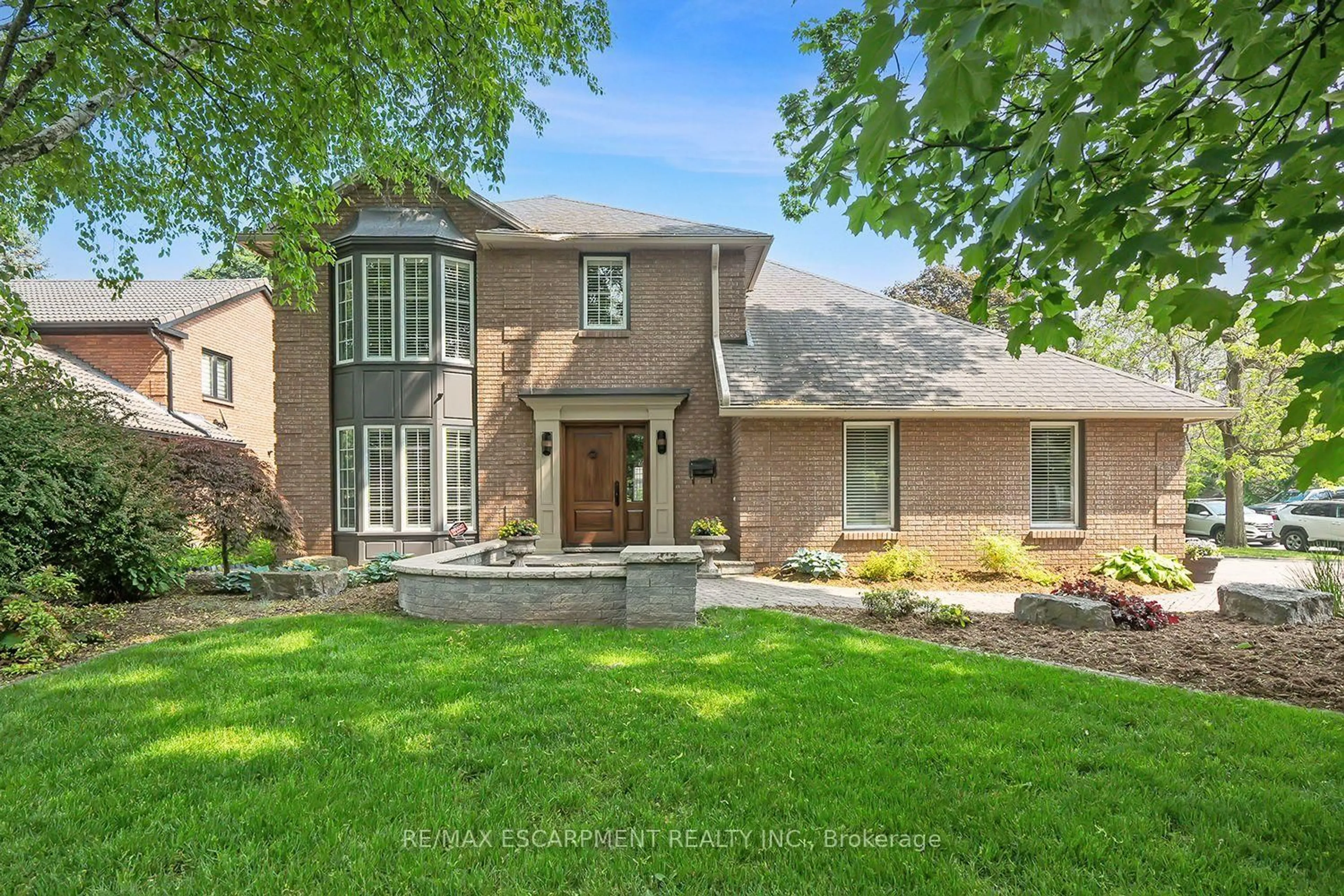 Home with brick exterior material, street for 2428 Lakeshore Rd, Burlington Ontario L7R 1C1