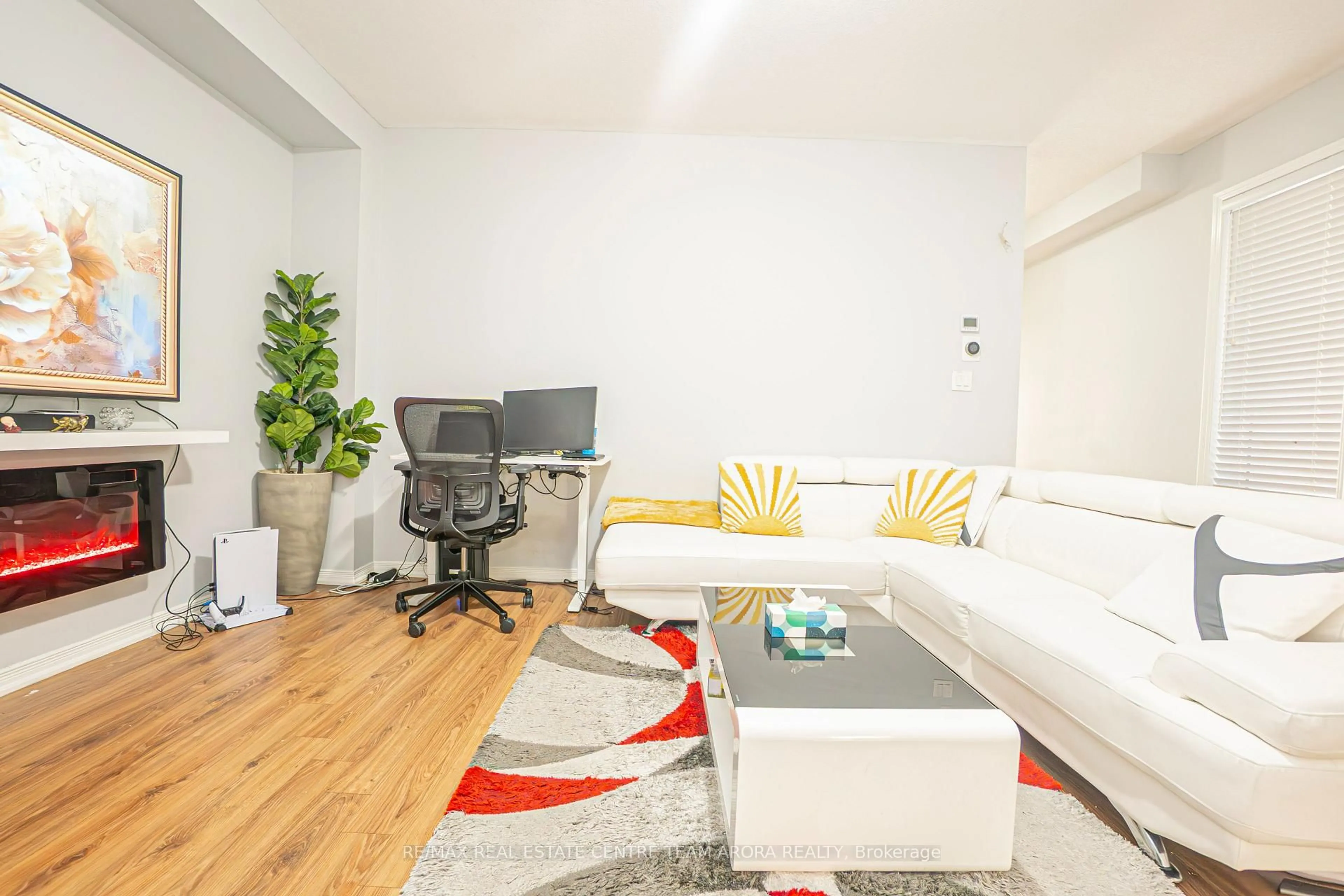 Living room with furniture, wood/laminate floor for 157 Baffin Cres, Brampton Ontario L7A 4K7