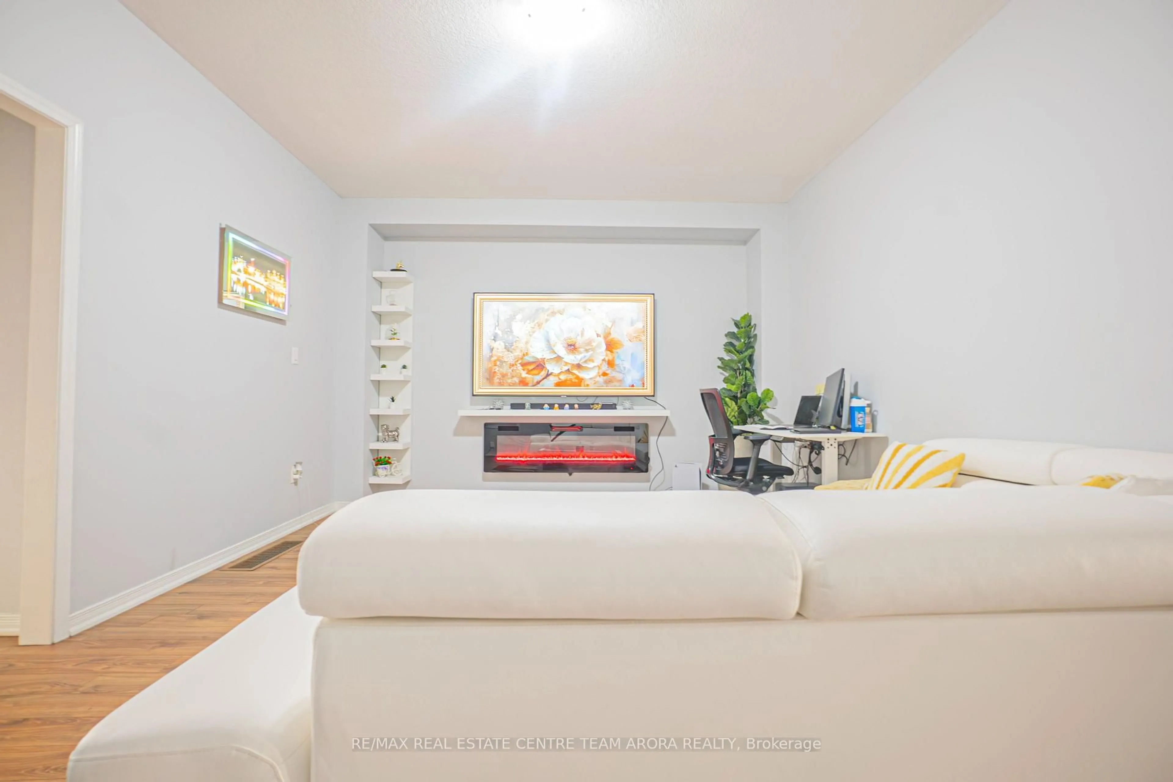 Living room with furniture, wood/laminate floor for 157 Baffin Cres, Brampton Ontario L7A 4K7