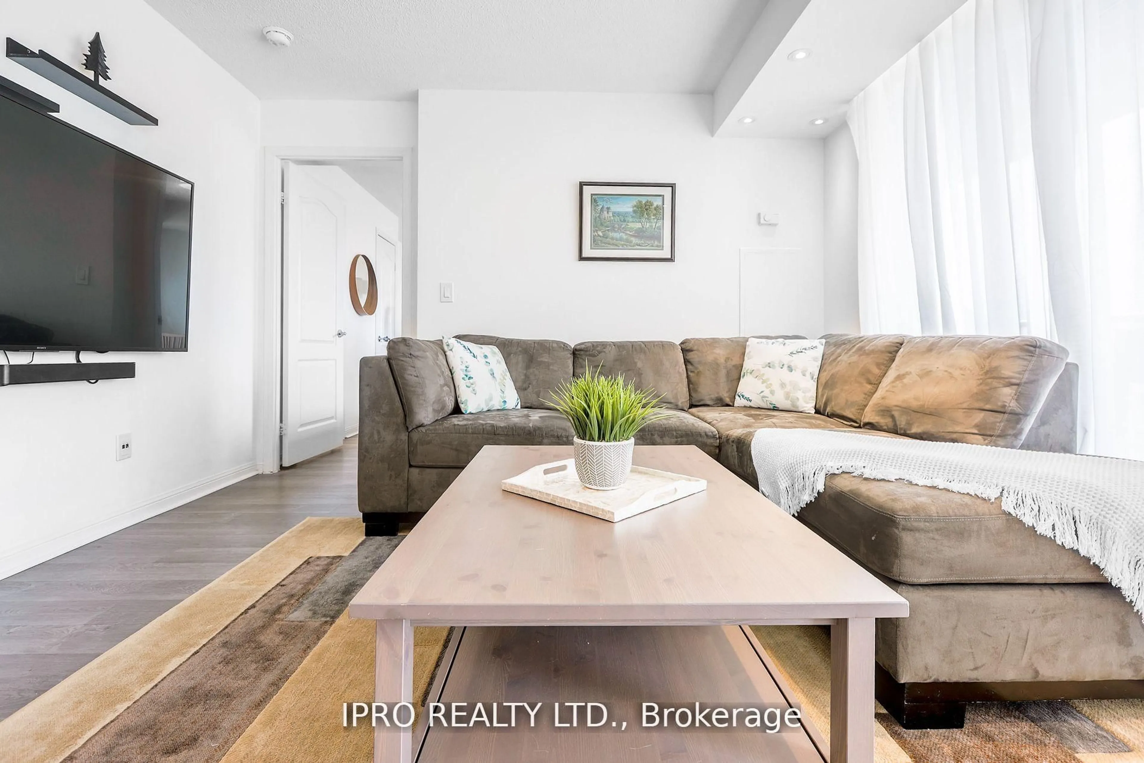 Living room with furniture, wood/laminate floor for 1150 Parkwest Pl #503, Mississauga Ontario L5E 3K4