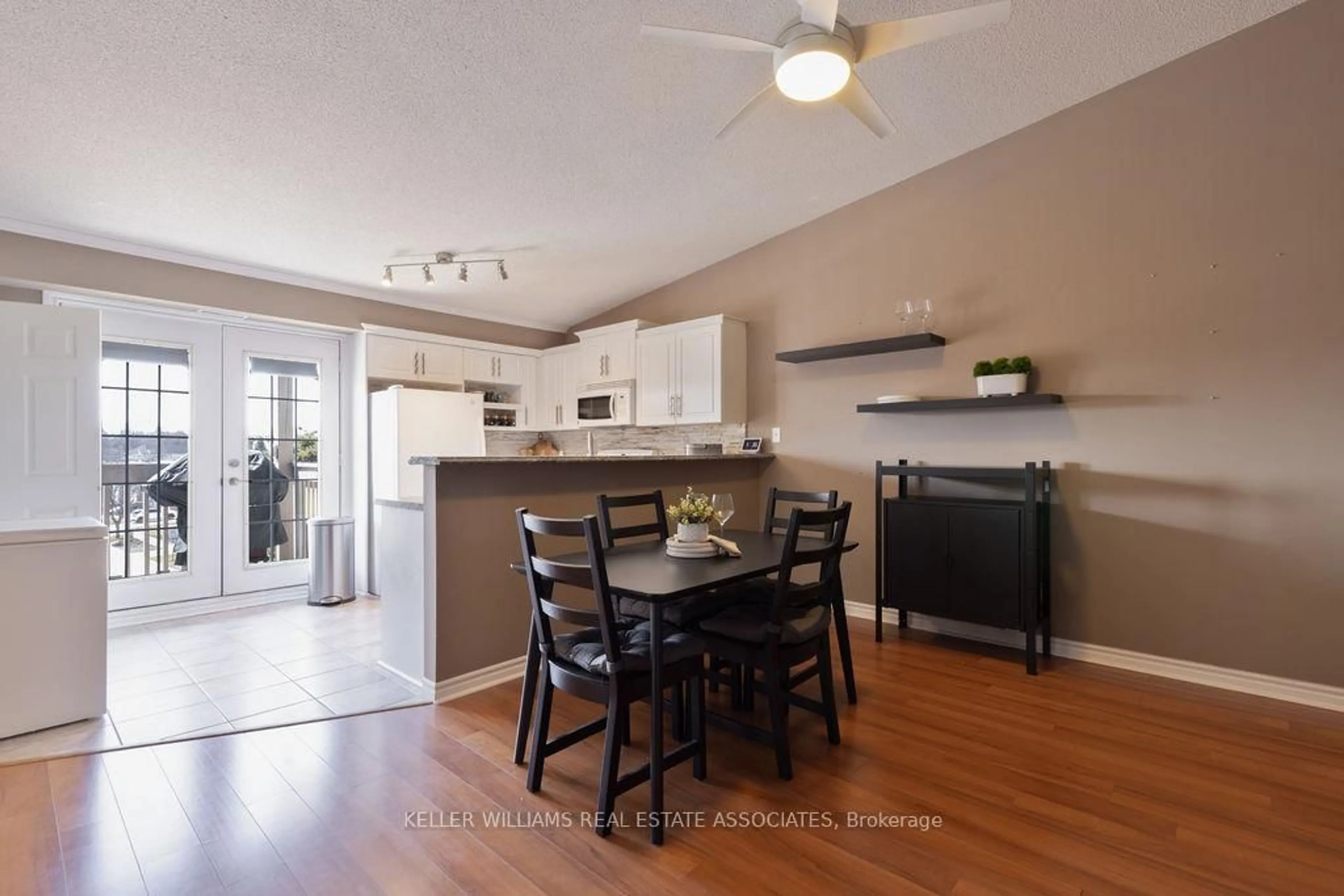 Open concept kitchen, wood/laminate floor for 4003 Kilmer Dr #411, Burlington Ontario L7M 4M1