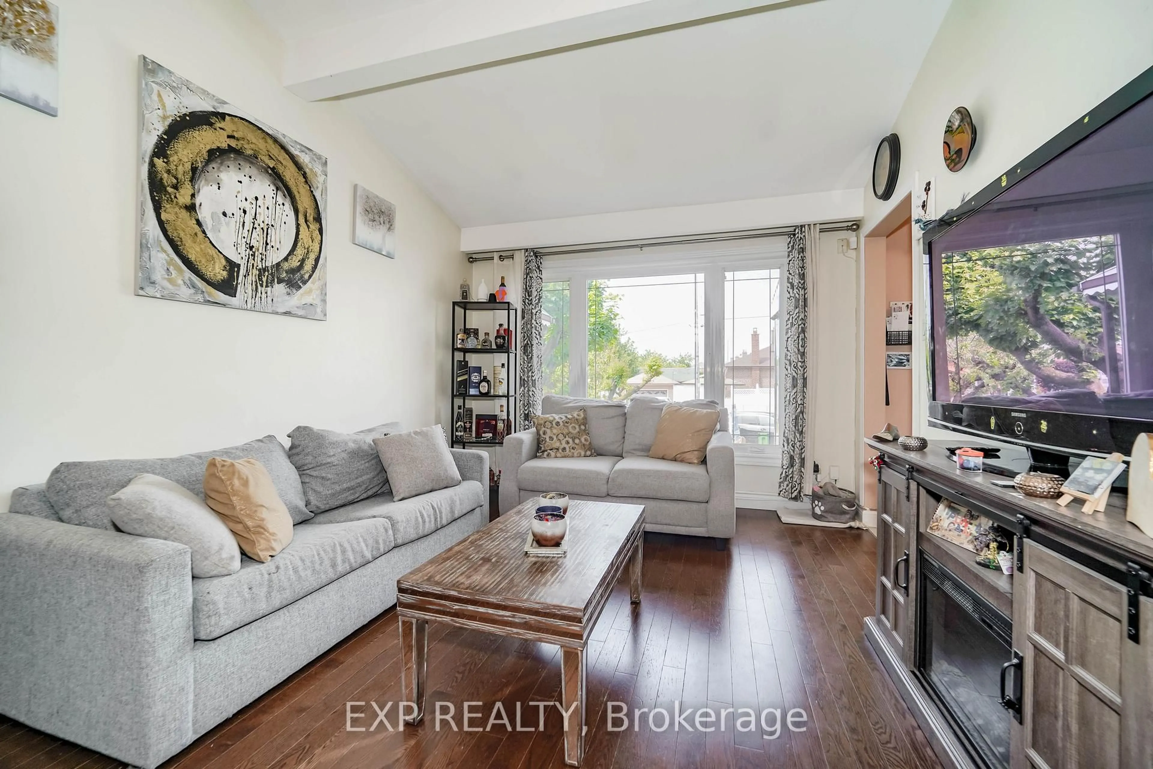 Living room with furniture, wood/laminate floor for 69 Lomar Dr, Toronto Ontario M3N 1Z2