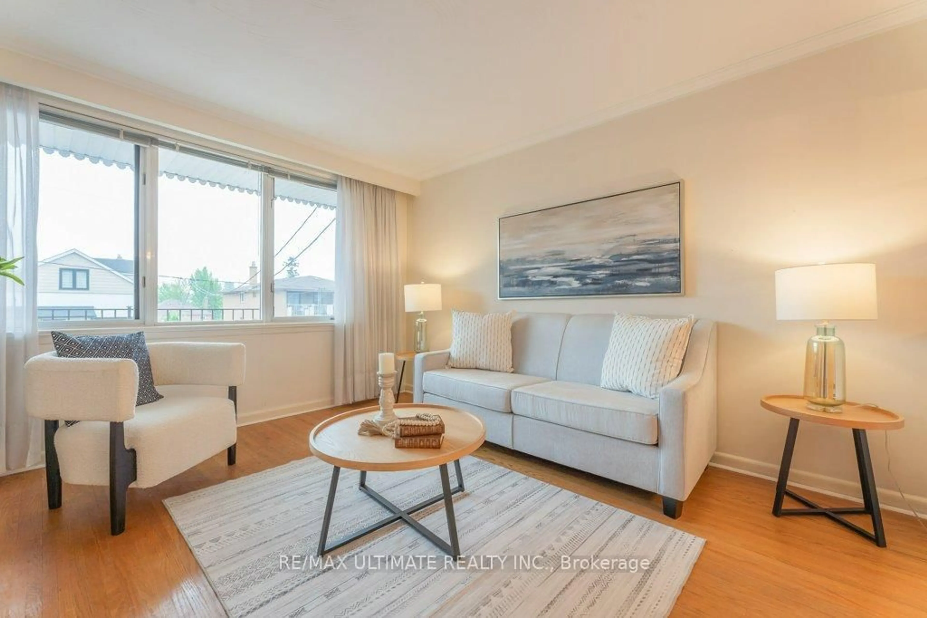 Living room with furniture, wood/laminate floor for 28 Lacey Ave, Toronto Ontario M6M 3L7