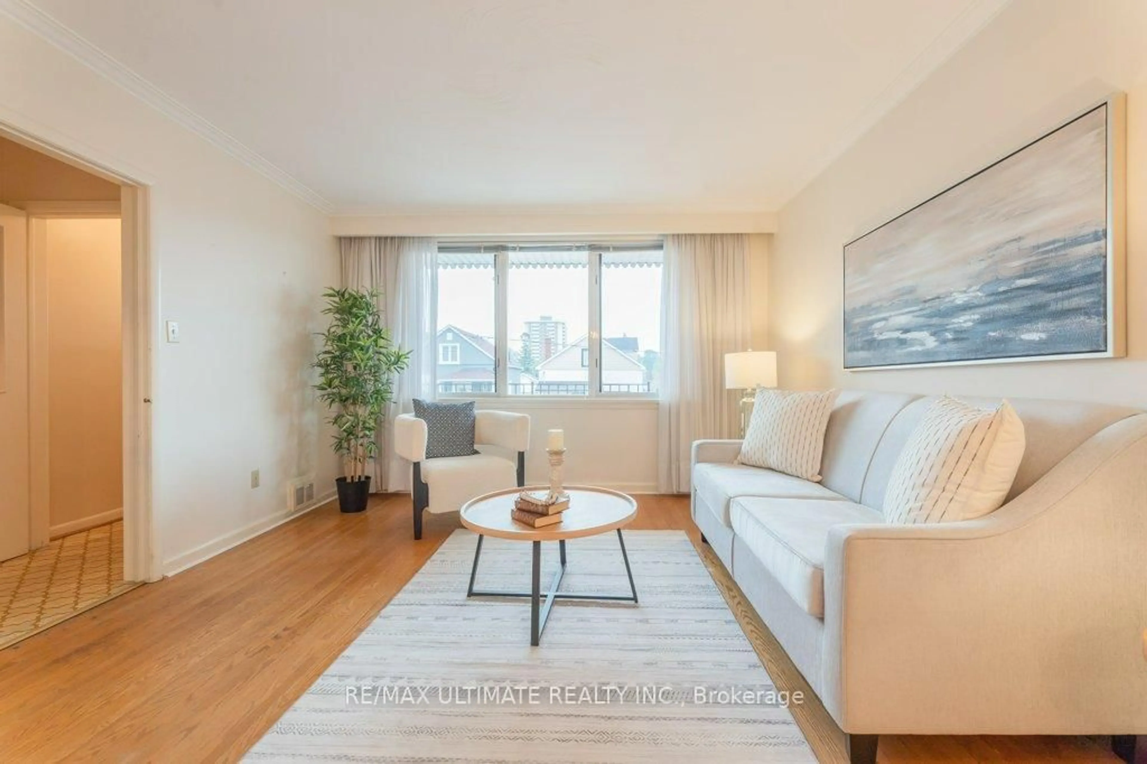 Living room with furniture, wood/laminate floor for 28 Lacey Ave, Toronto Ontario M6M 3L7
