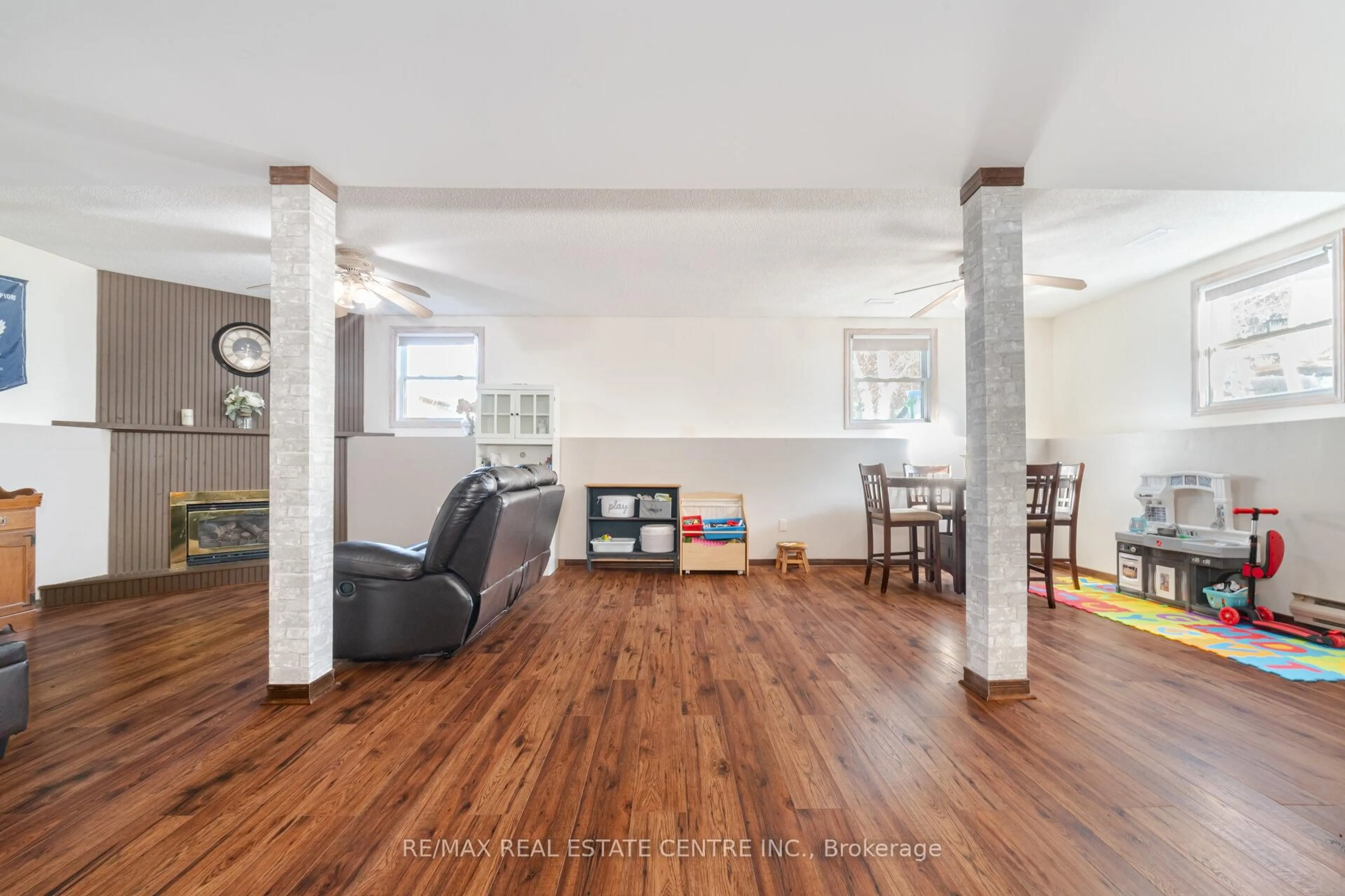 Living room with furniture, wood/laminate floor for 49 Mcclellan Rd, Caledon Ontario L7K 0C8