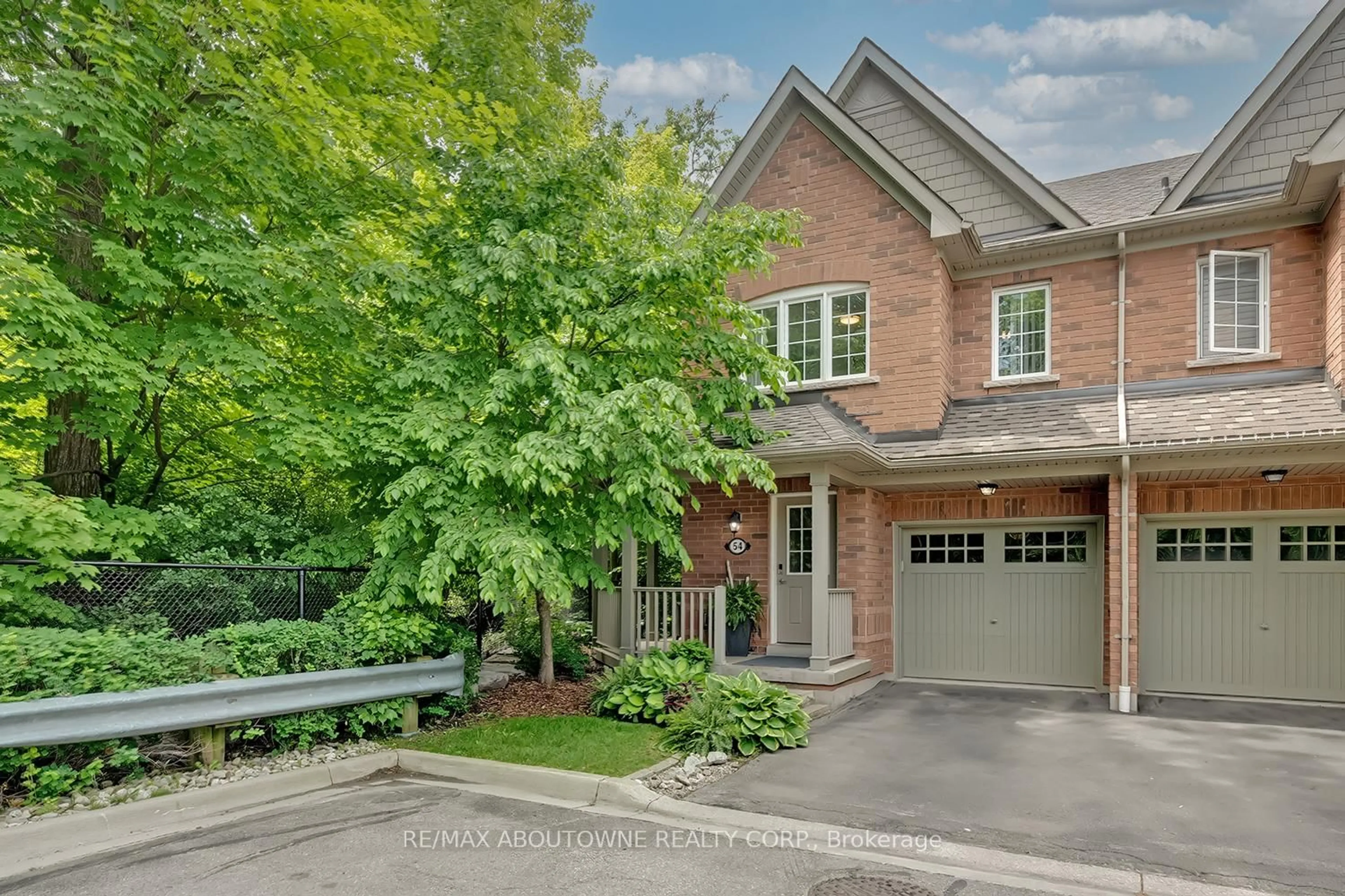 Home with brick exterior material, street for 233 Duskywing Way #54, Oakville Ontario L6L 0C5