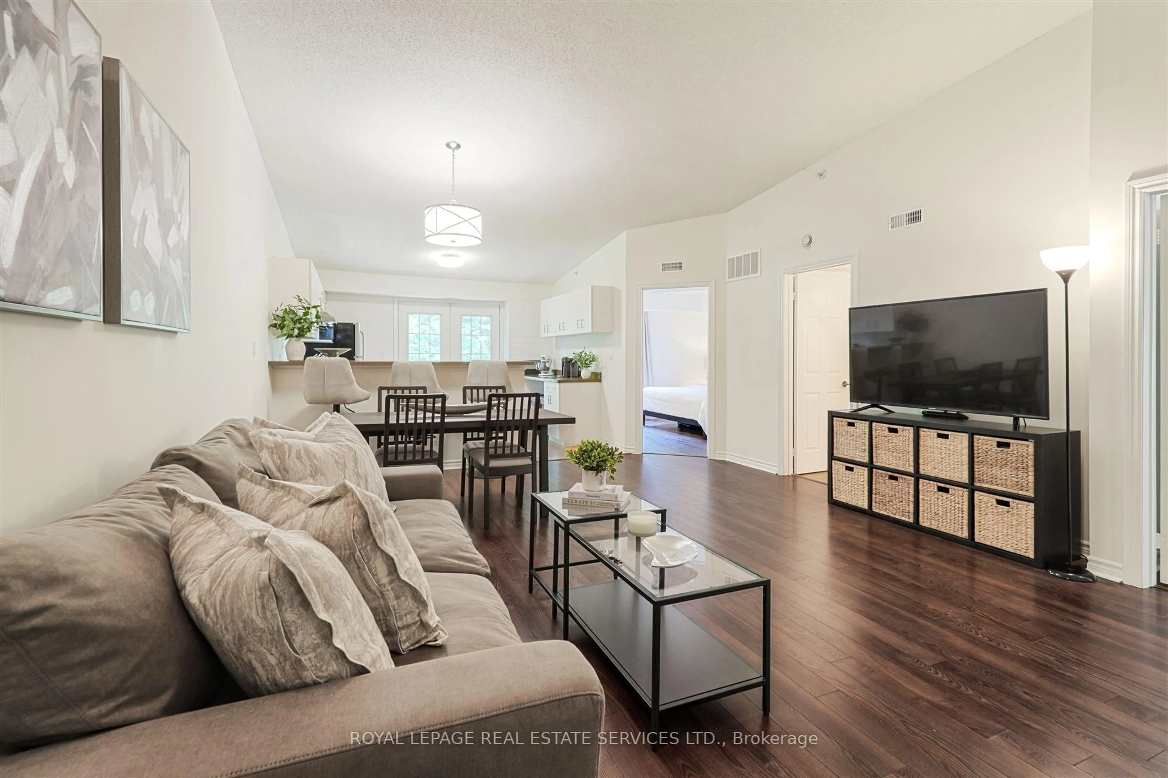 Living room with furniture, wood/laminate floor for 4025 Kilmer Dr #407, Burlington Ontario L7M 4M5