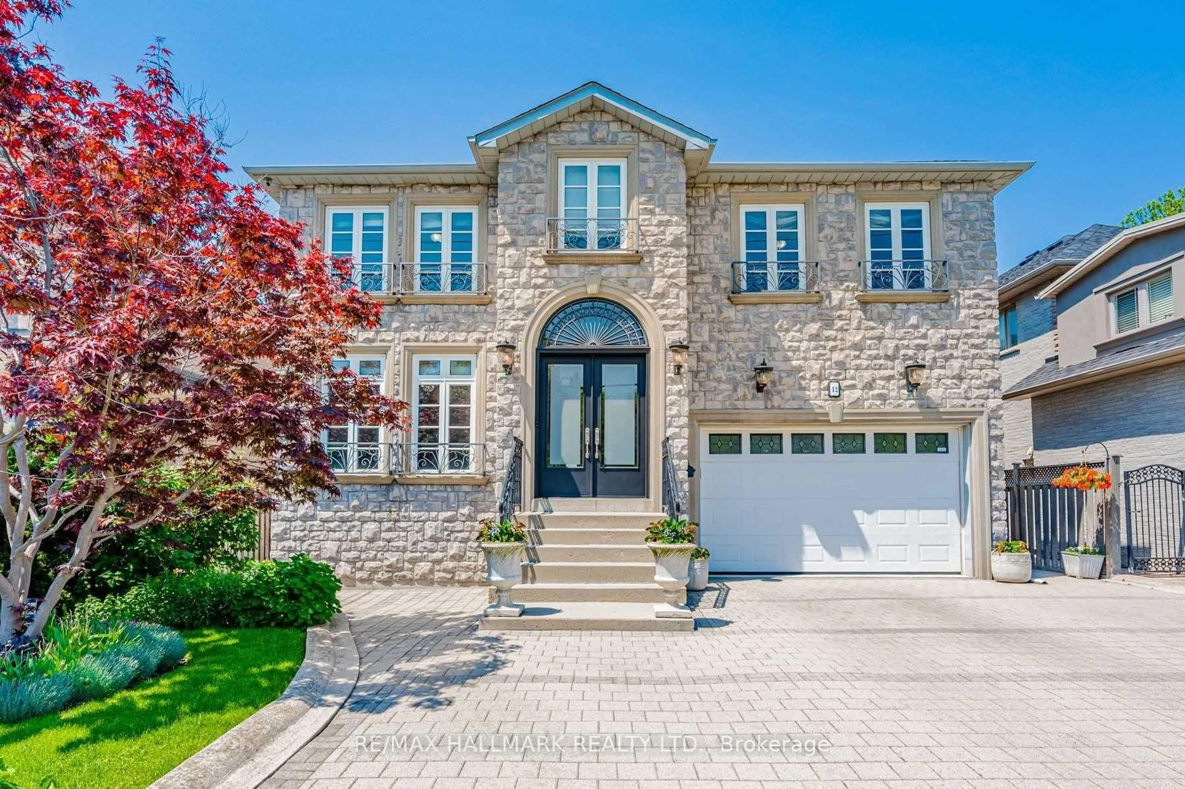Home with brick exterior material, street for 12 Highland Hill, Toronto Ontario M6A 2P8