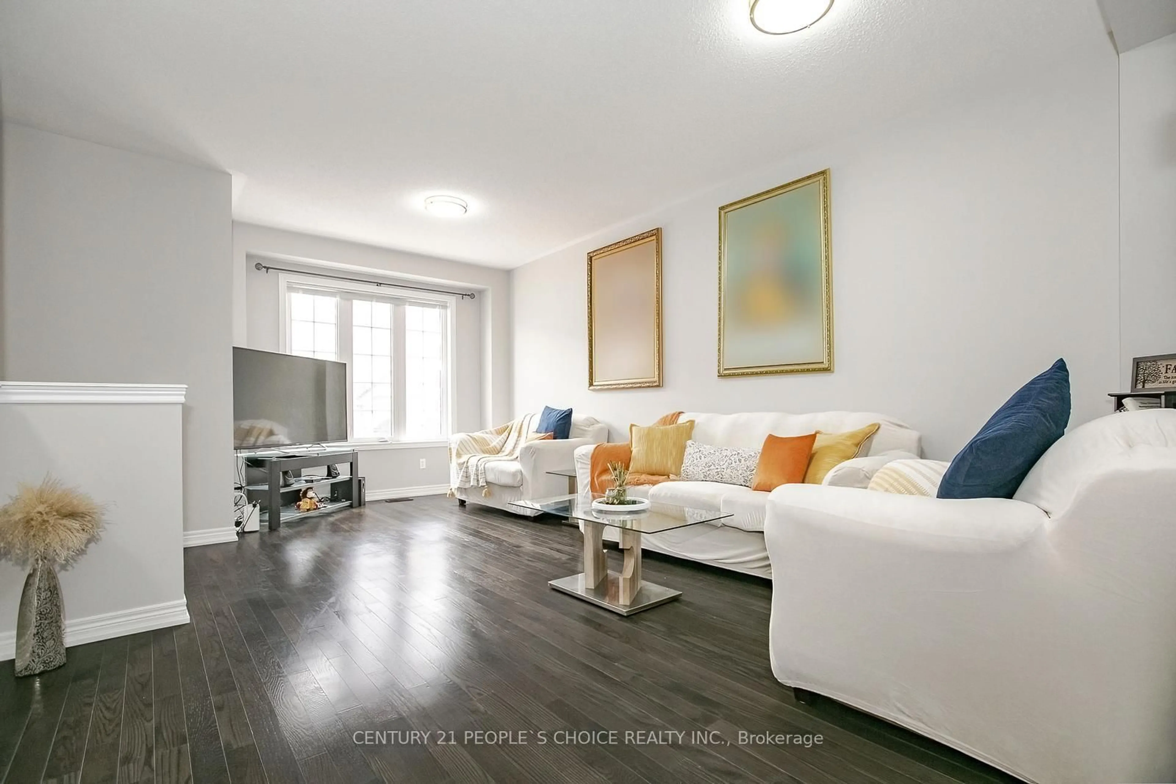 Living room with furniture, wood/laminate floor for 85 Sea Drifter Cres, Brampton Ontario L6P 2S1