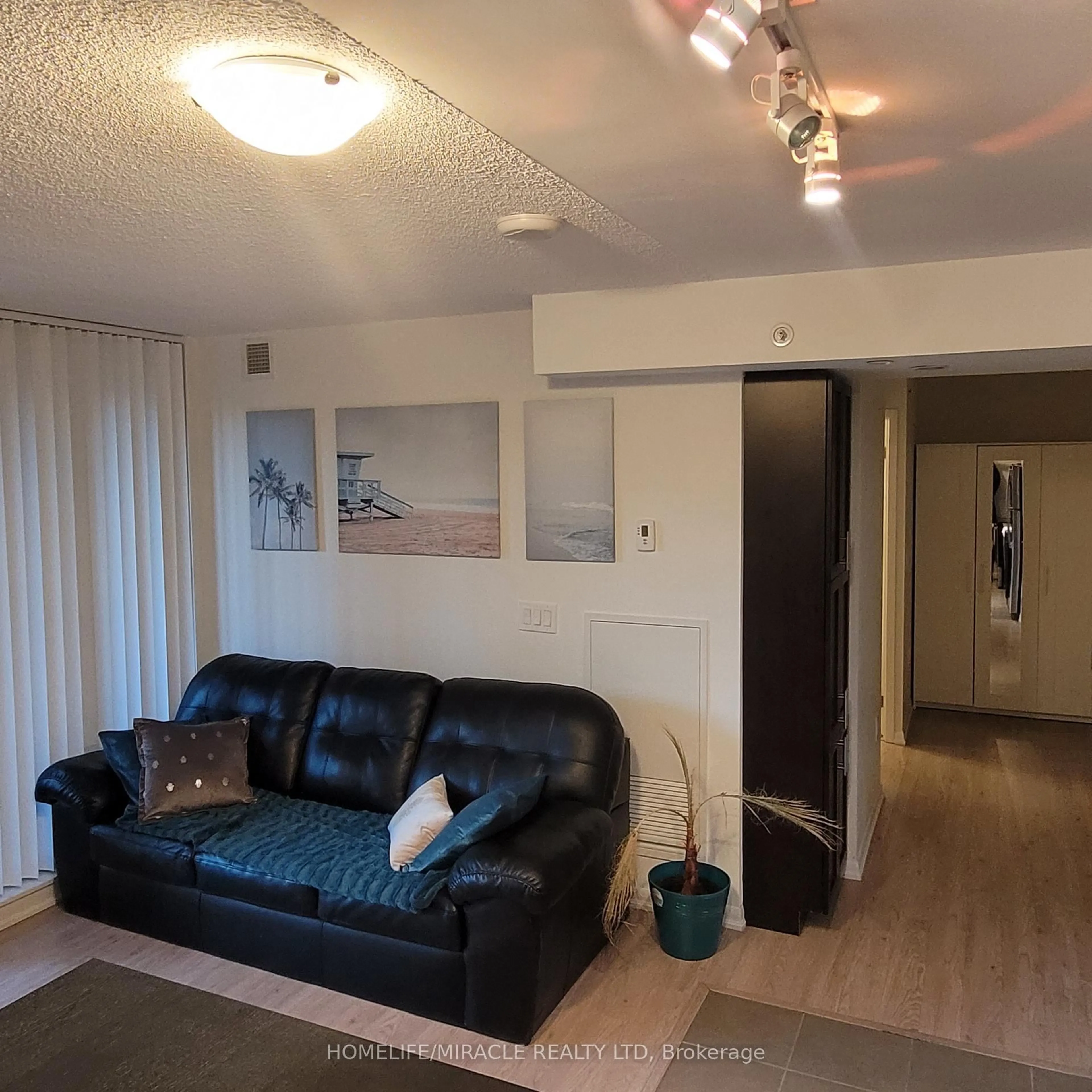 Living room with furniture, wood/laminate floor for 830 Lawrence Ave #529, Toronto Ontario M6A 0A2