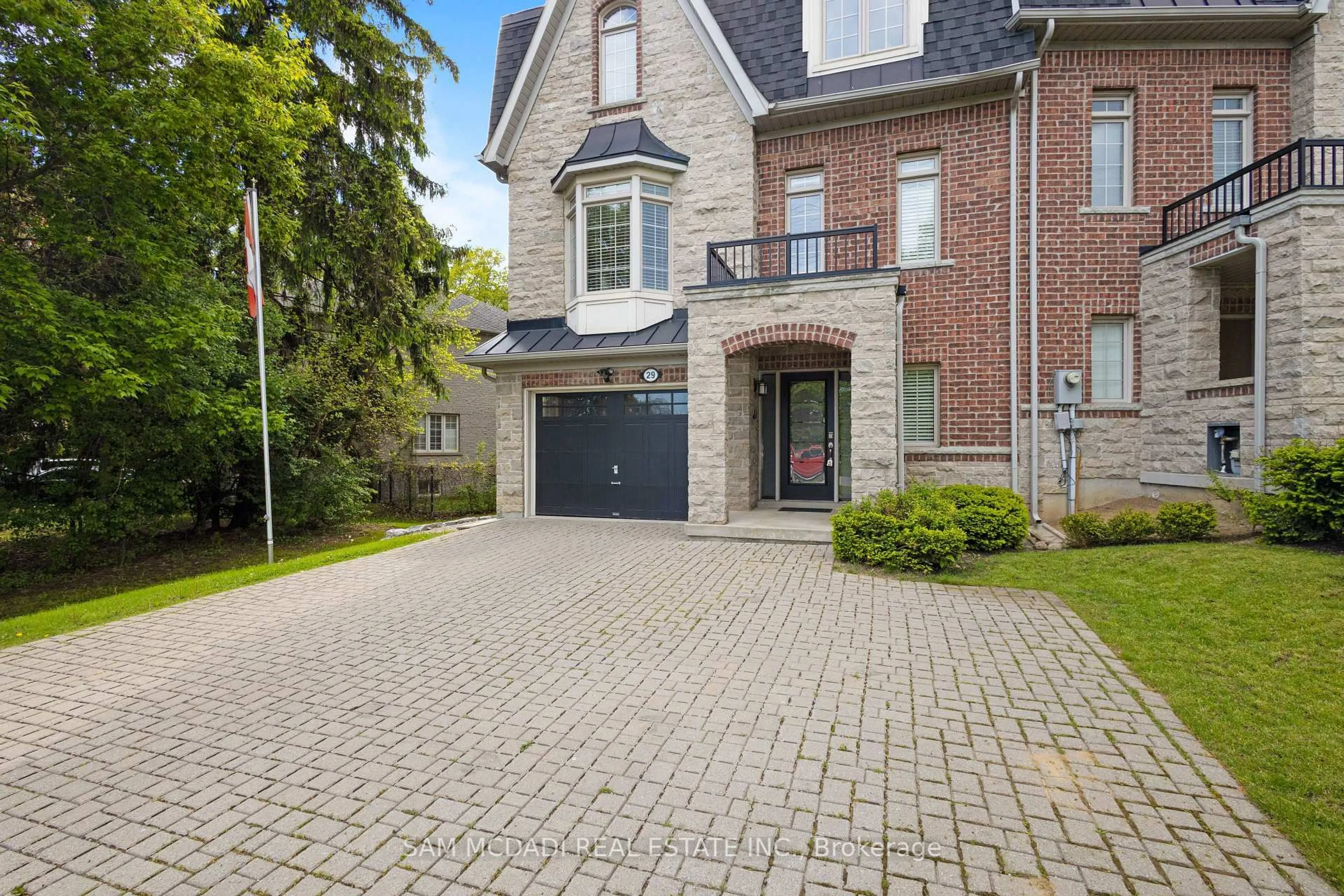 Home with brick exterior material, street for 29 Premium Way, Mississauga Ontario L5B 1A1