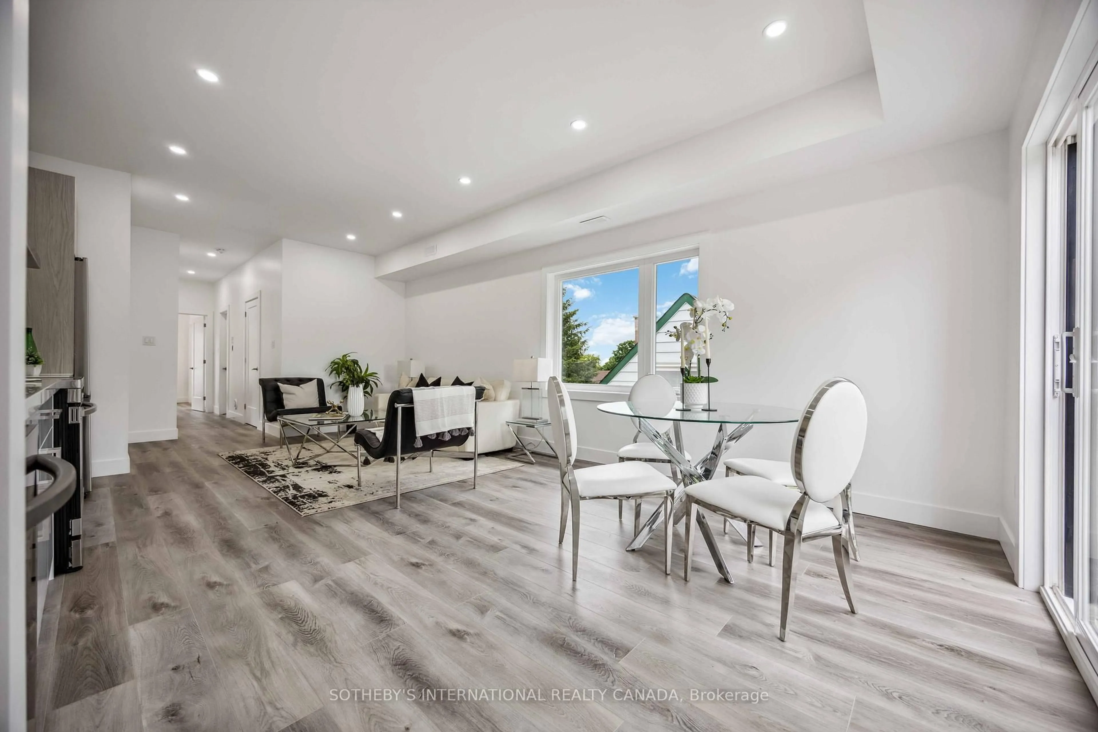 Dining room, wood/laminate floor for 1925 Lawrence Ave, Toronto Ontario M9N 1G8