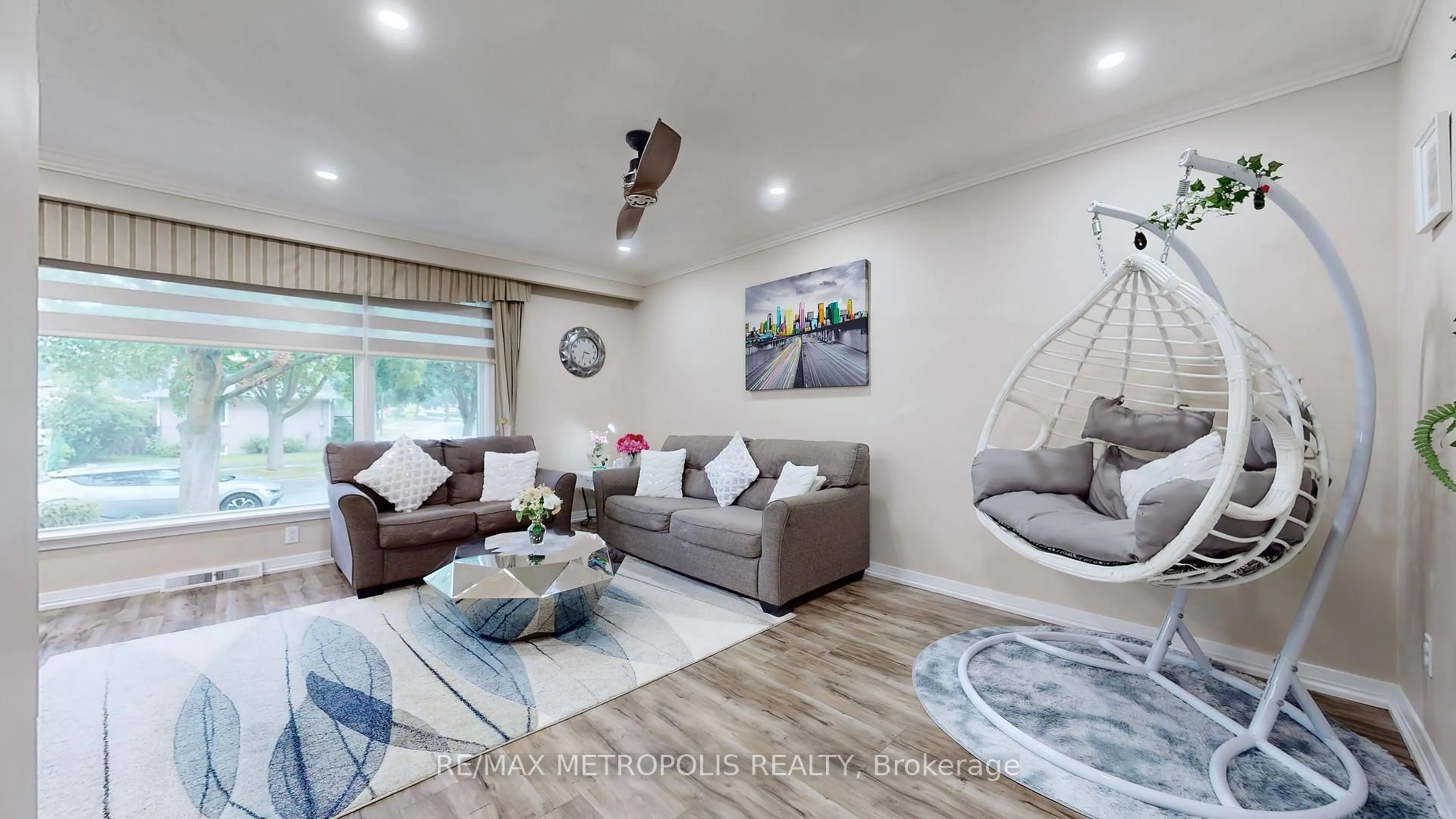 Living room with furniture, wood/laminate floor for 65 Alhart Dr, Toronto Ontario M9V 2N1