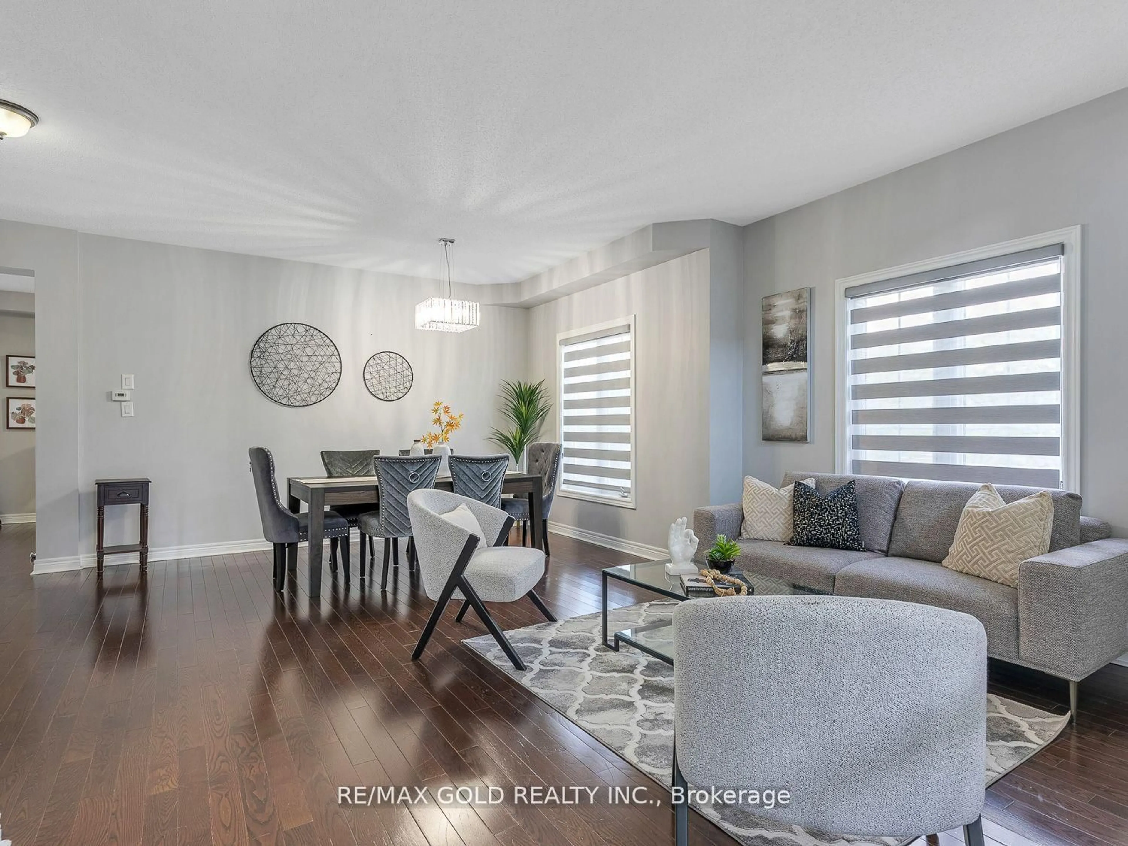 Living room with furniture, wood/laminate floor for 8 Moss Way, Brampton Ontario L6R 0P6