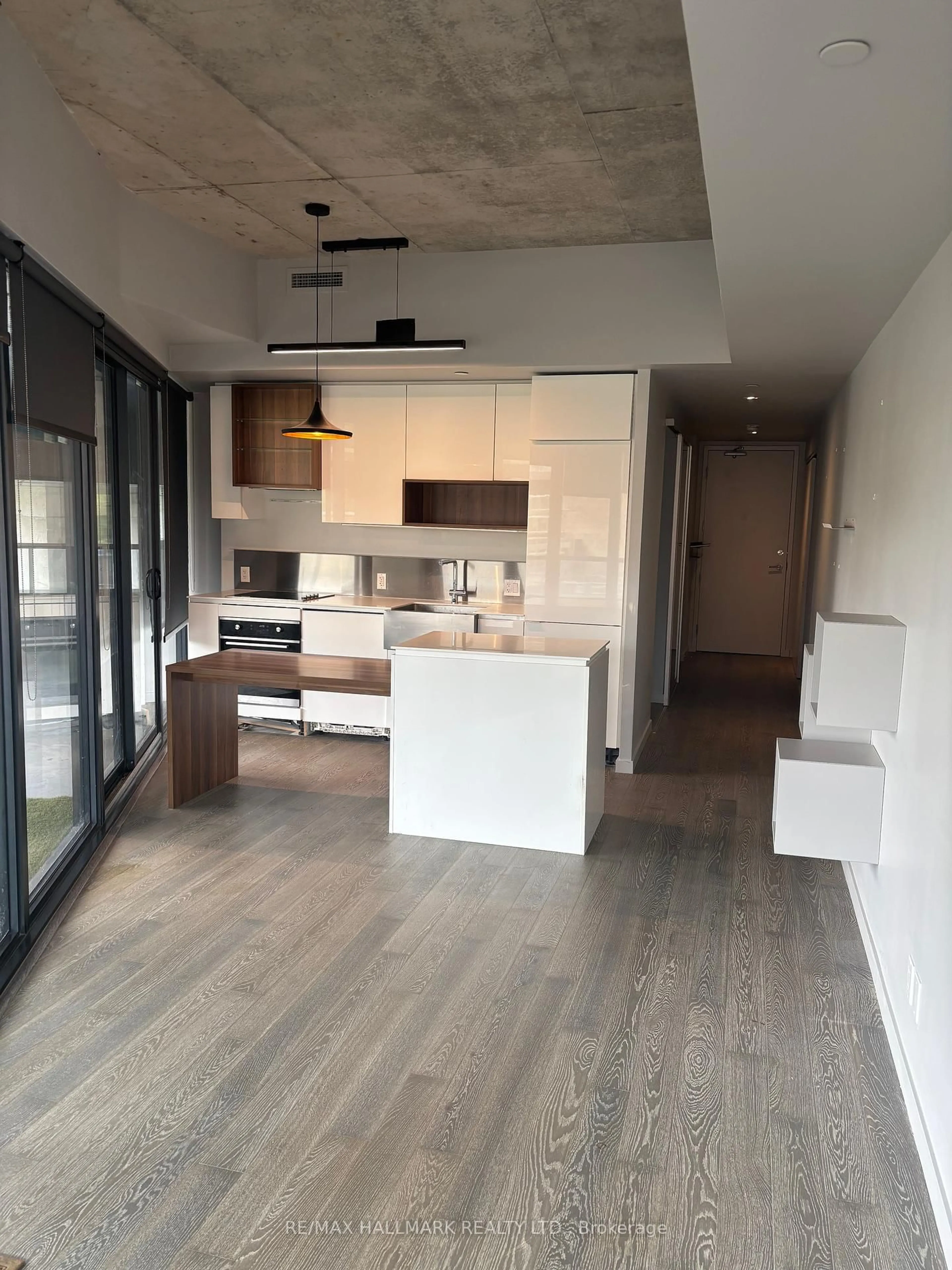Open concept kitchen, wood/laminate floor for 383 Sorauren Ave #209, Toronto Ontario M6R 0A4