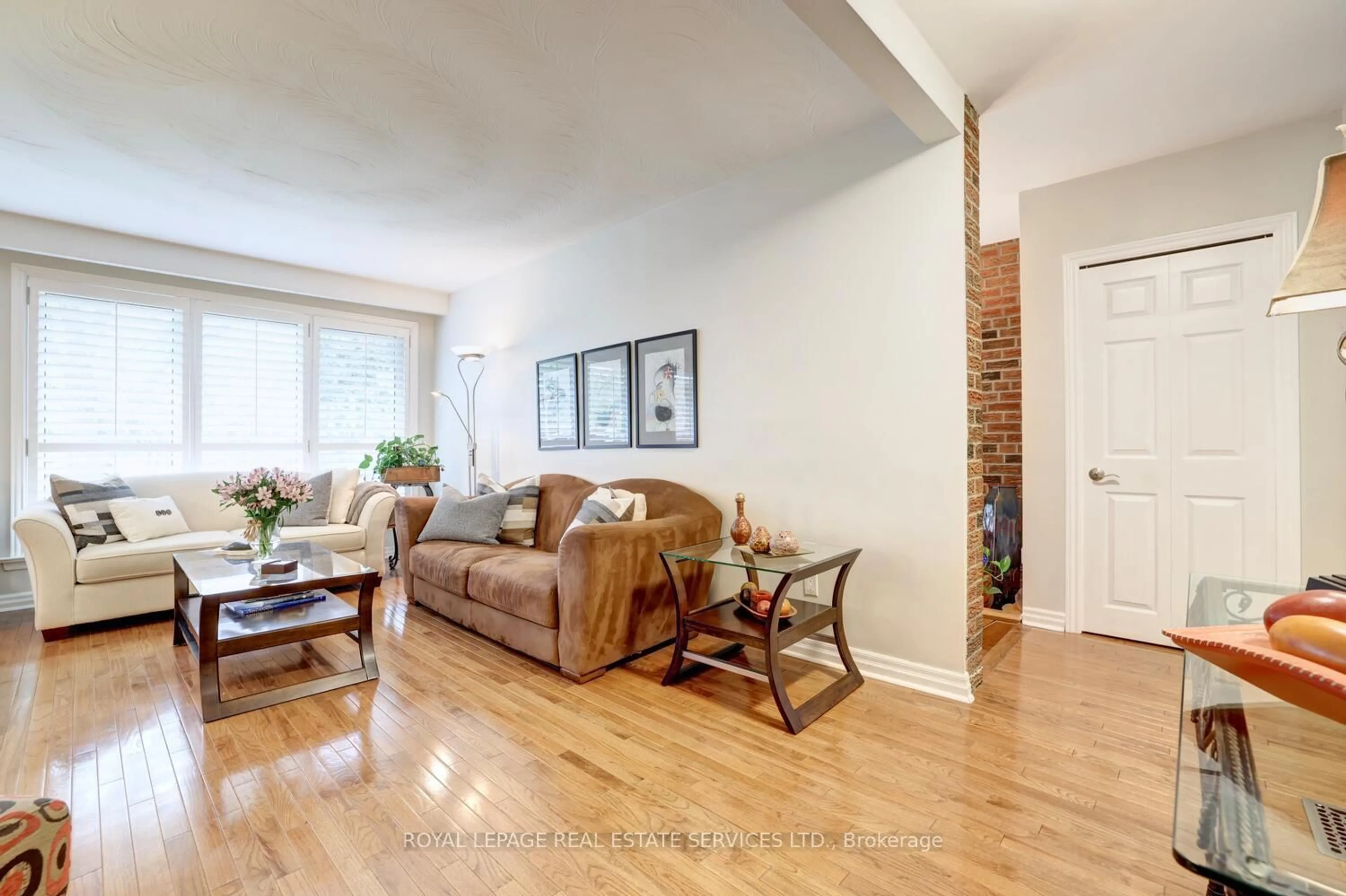 Living room with furniture, wood/laminate floor for 26 Cromer Pl, Toronto Ontario M9R 2E1