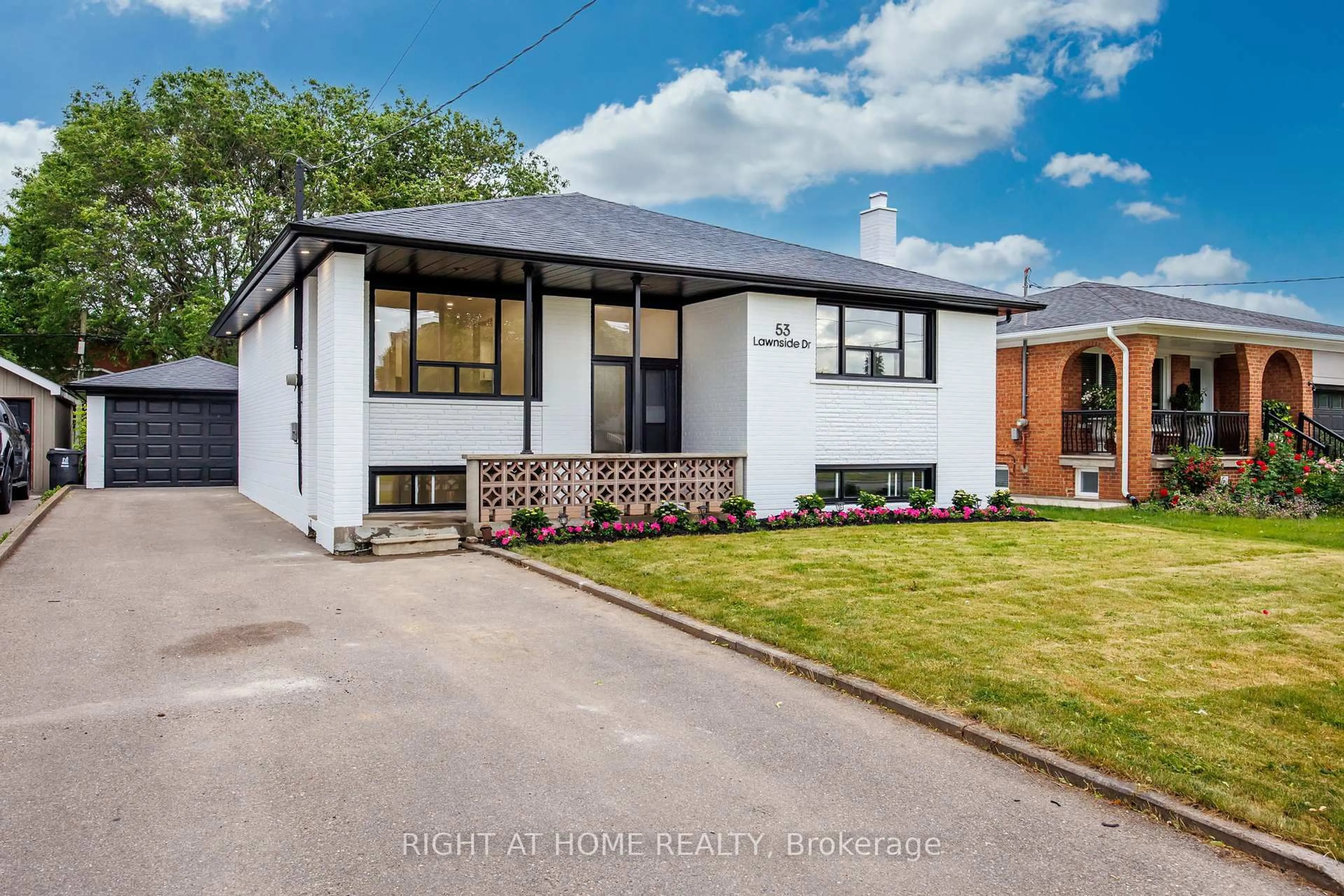 Home with brick exterior material, street for 53 Lawnside Dr, Toronto Ontario M6L 1Z4