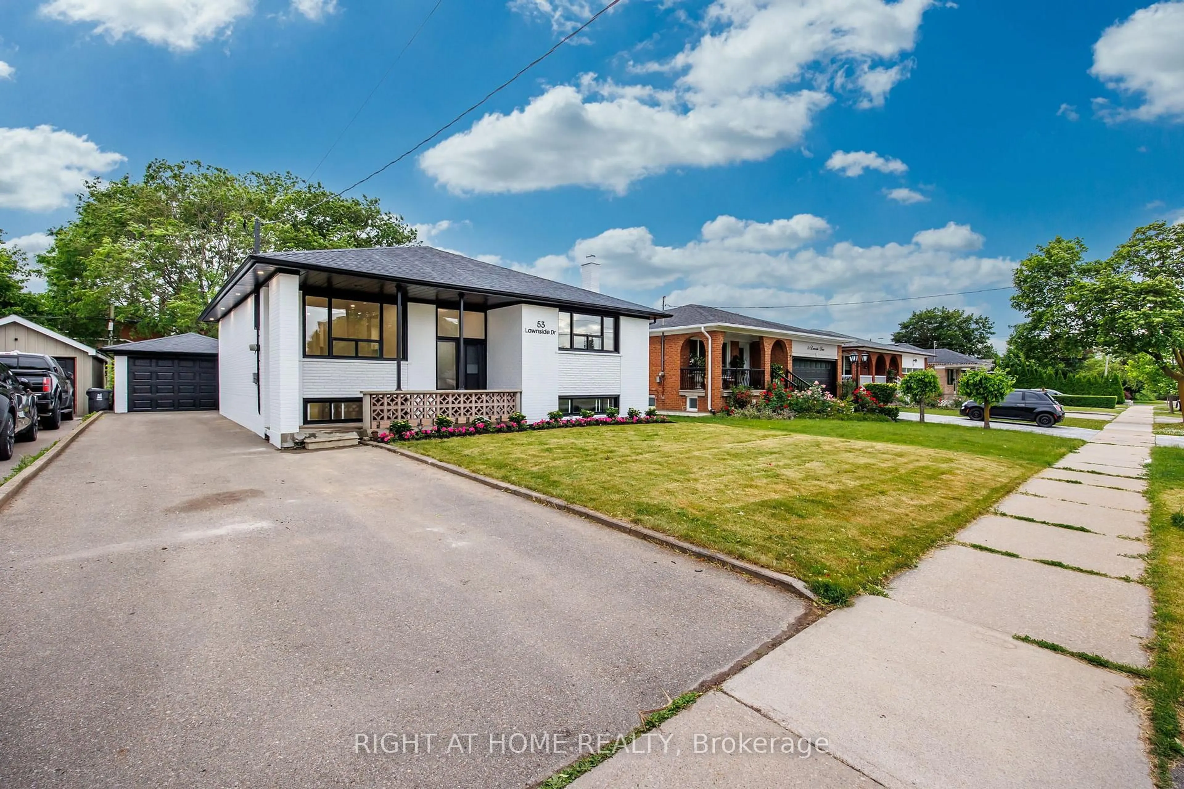 A pic from outside/outdoor area/front of a property/back of a property/a pic from drone, street for 53 Lawnside Dr, Toronto Ontario M6L 1Z4