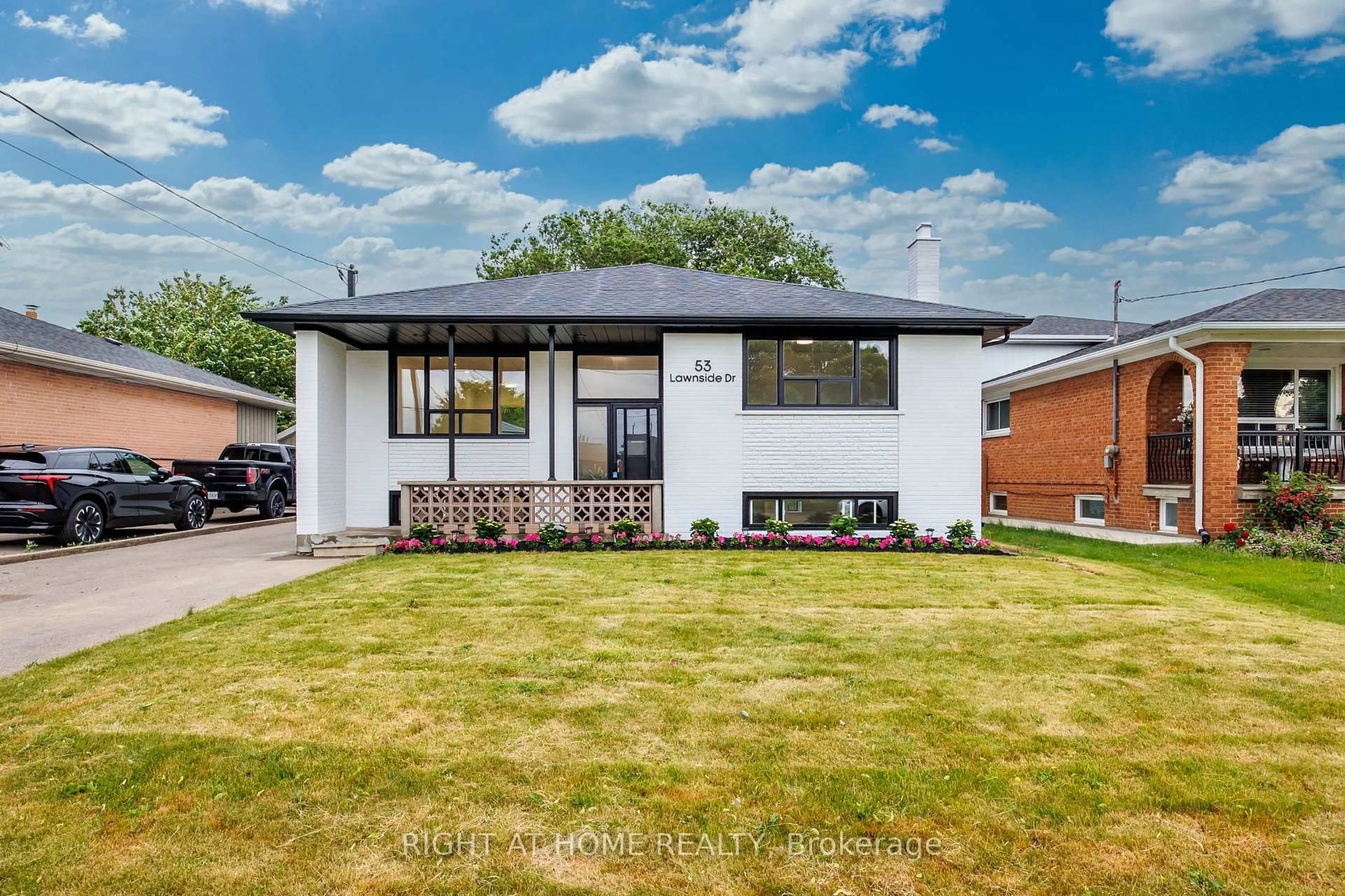 Home with brick exterior material, street for 53 Lawnside Dr, Toronto Ontario M6L 1Z4