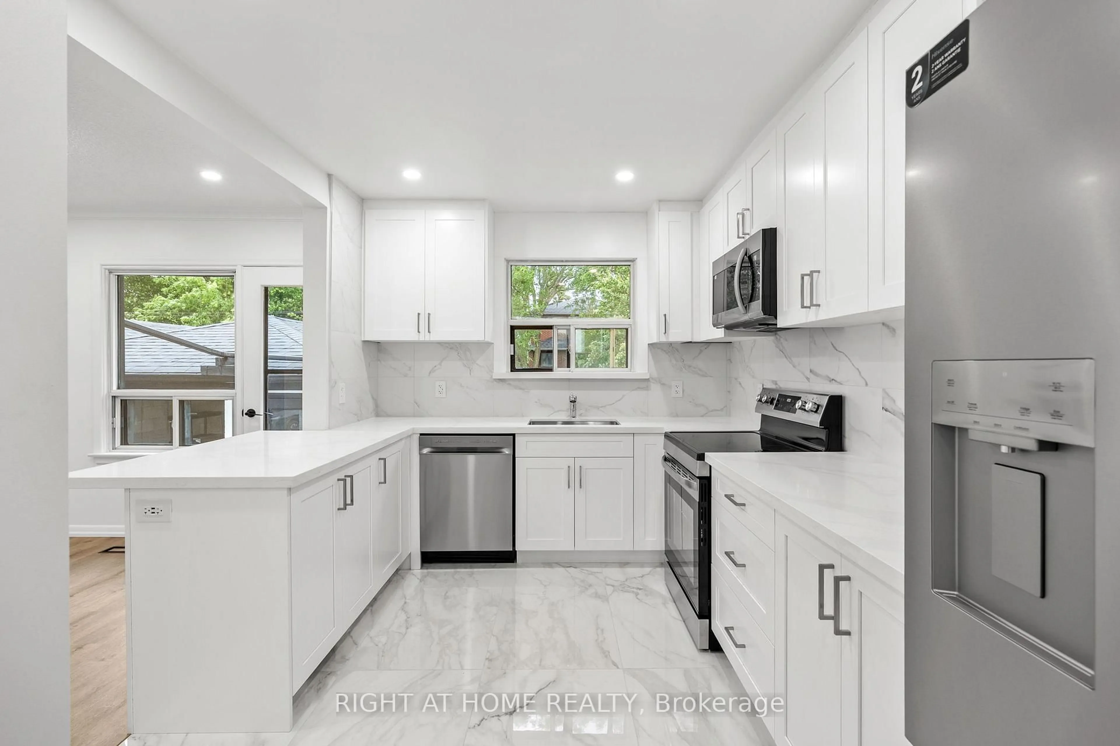 Open concept kitchen, ceramic/tile floor for 53 Lawnside Dr, Toronto Ontario M6L 1Z4