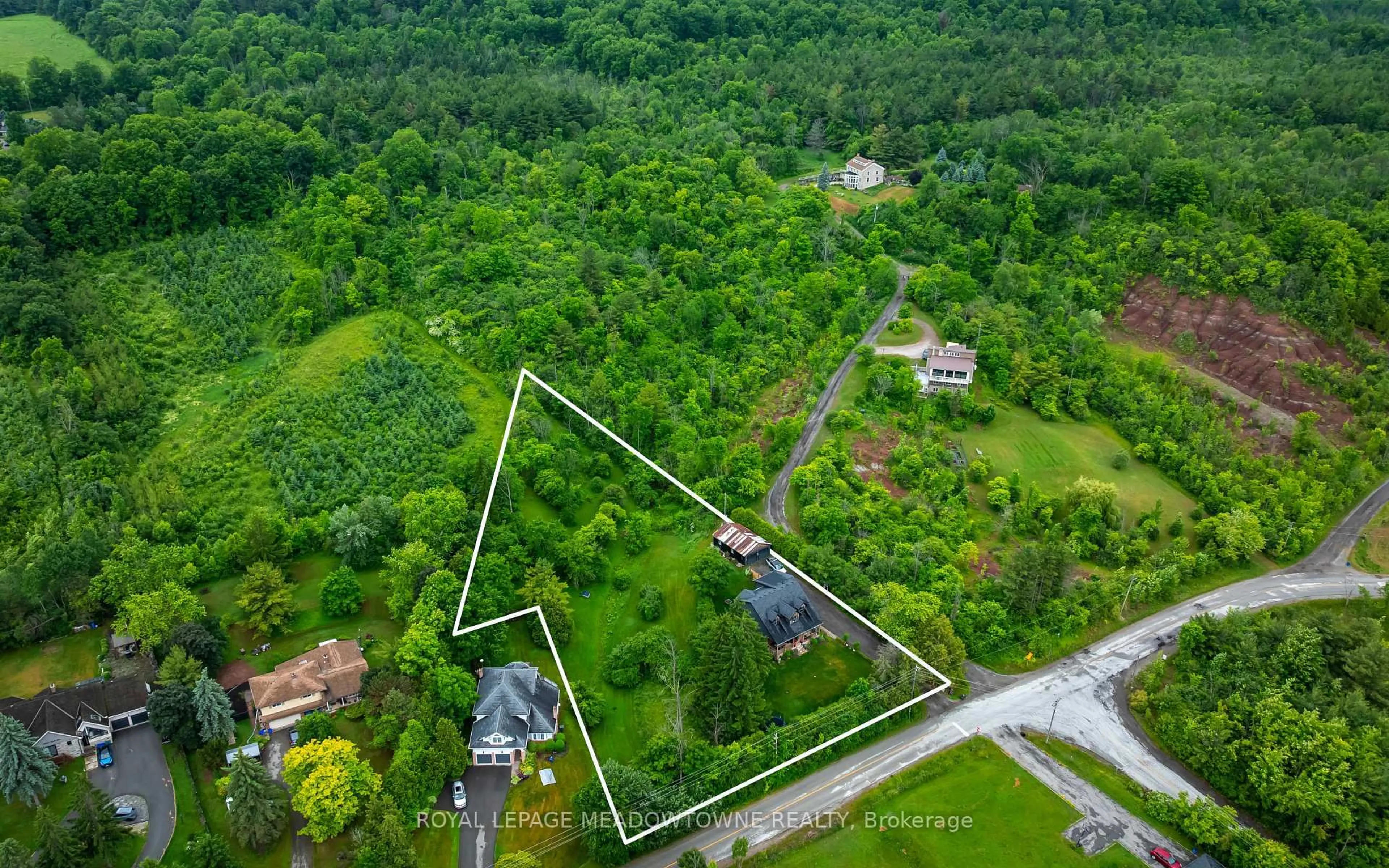 A pic from outside/outdoor area/front of a property/back of a property/a pic from drone, unknown for 13394 Tenth Line, Halton Hills Ontario L7G 4S8