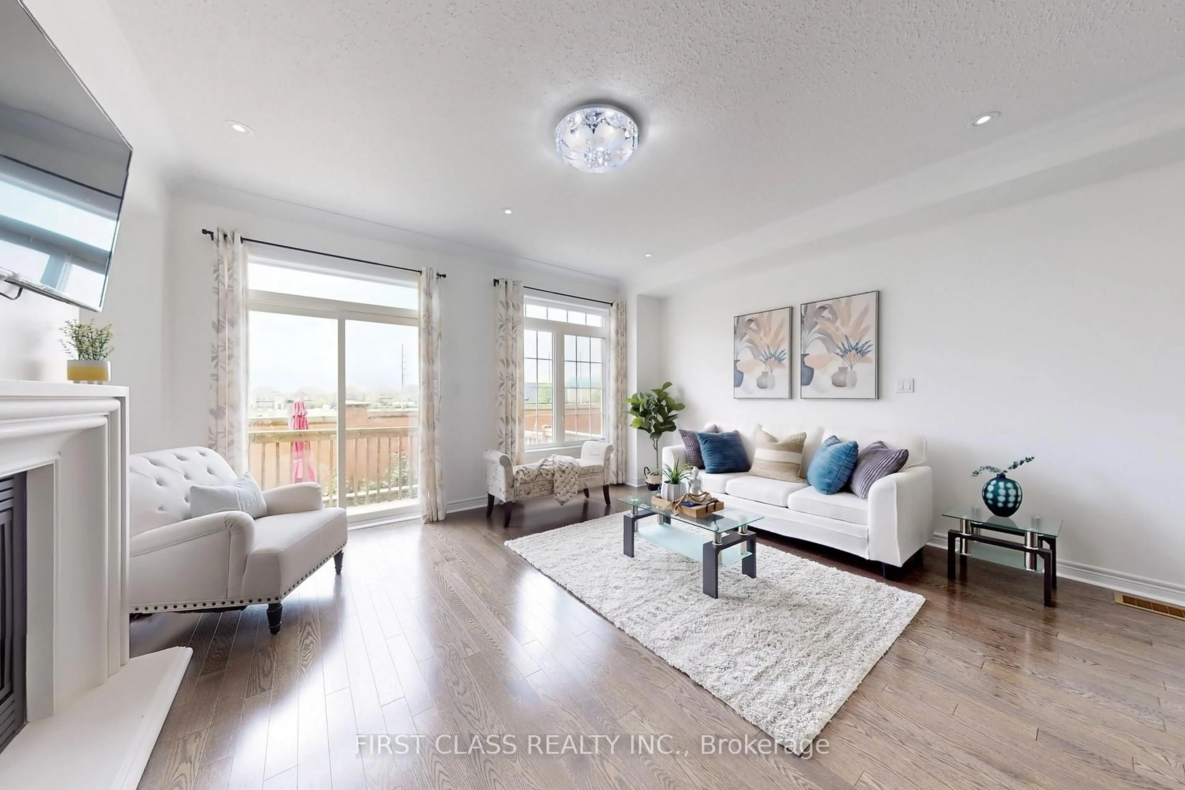 Living room with furniture, wood/laminate floor for 128 Sky Harbour Dr, Brampton Ontario L6Y 0V1