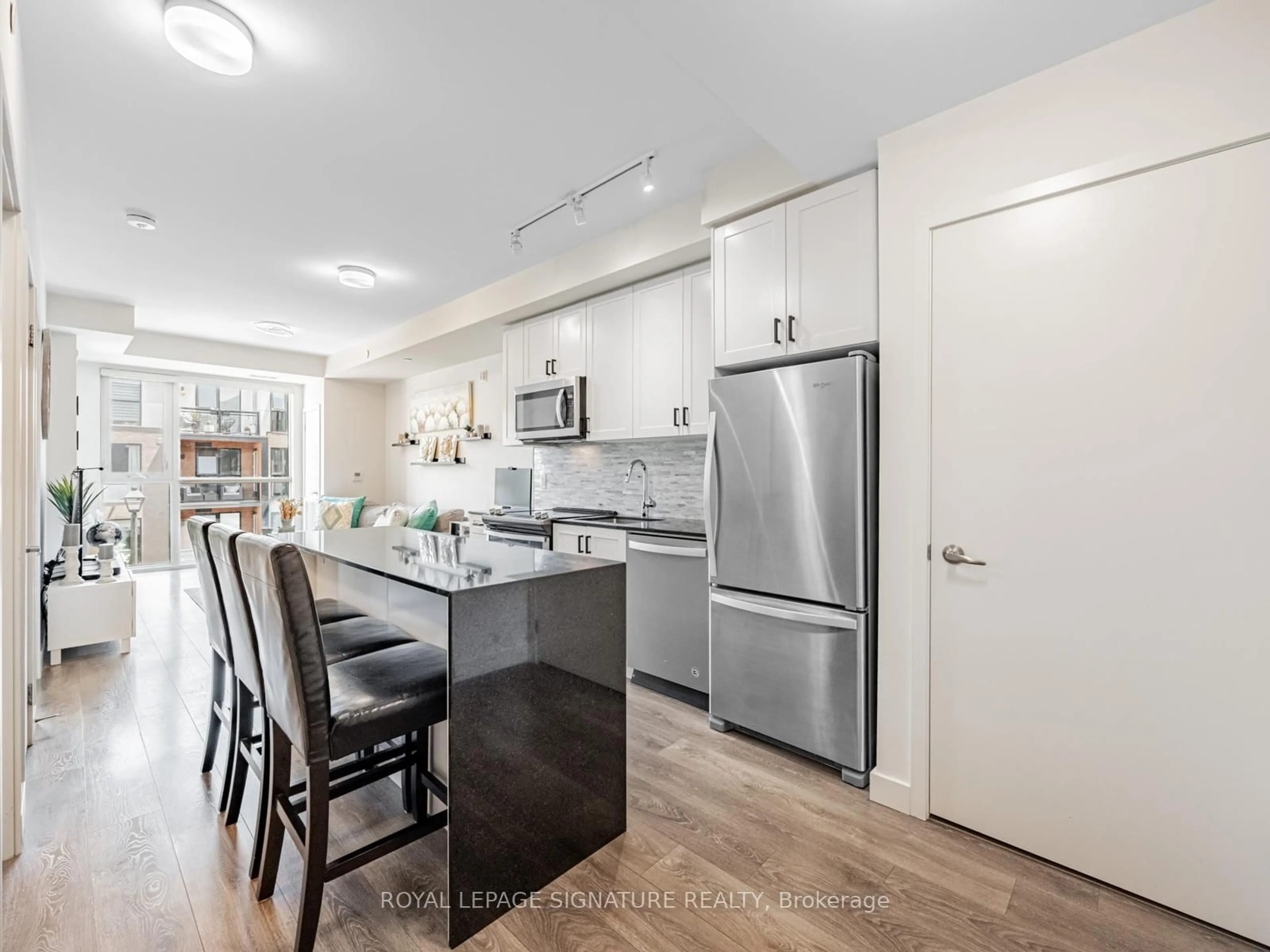 Open concept kitchen, wood/laminate floor for 210 Sabina Dr #308, Oakville Ontario L6H 0W6