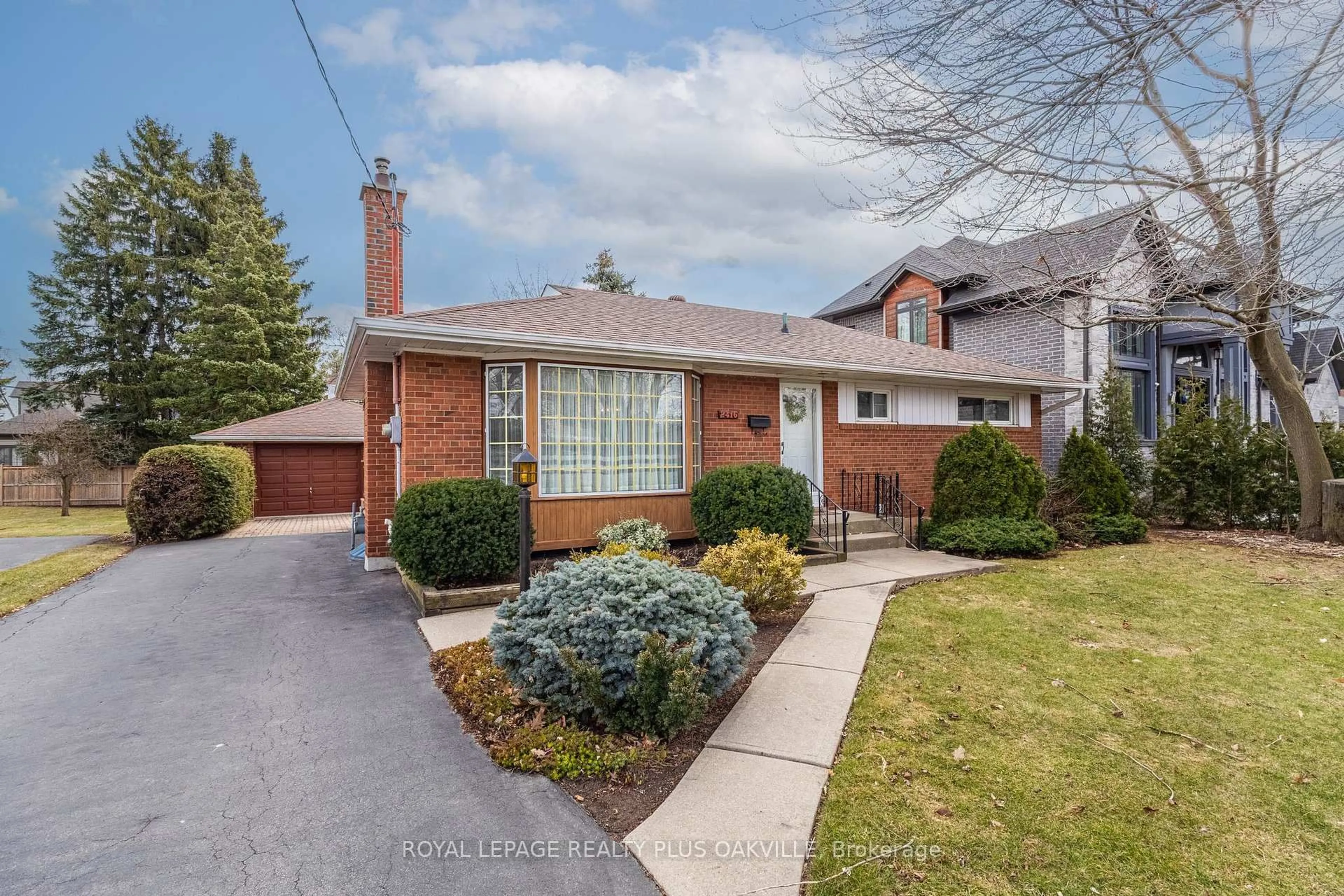 Home with brick exterior material, street for 2416 Rebecca St, Oakville Ontario L6L 2B2
