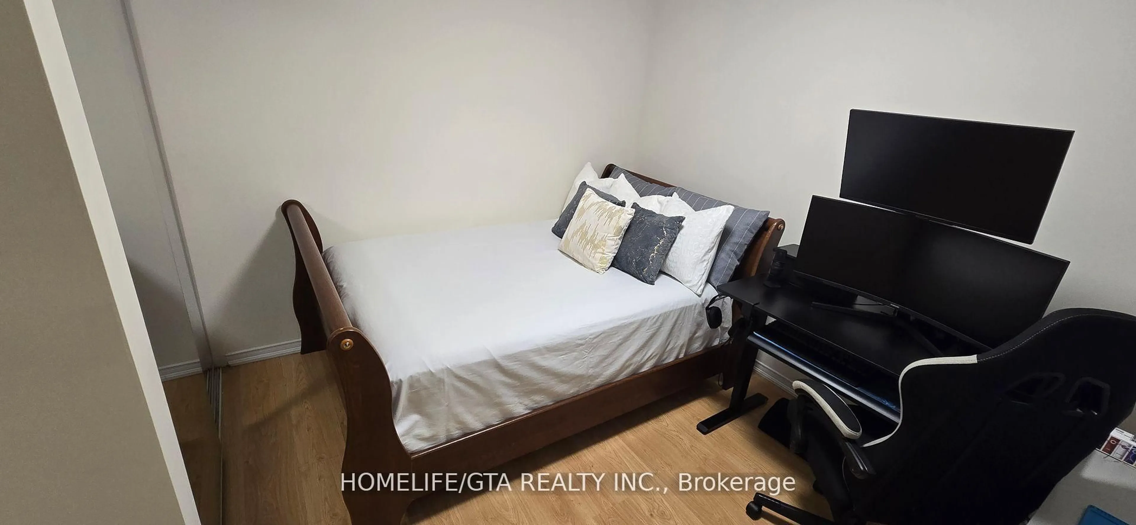 Bedroom with bed, wood/laminate floor for 157 Isaac Devins Blvd #3, Toronto Ontario M9M 0C5