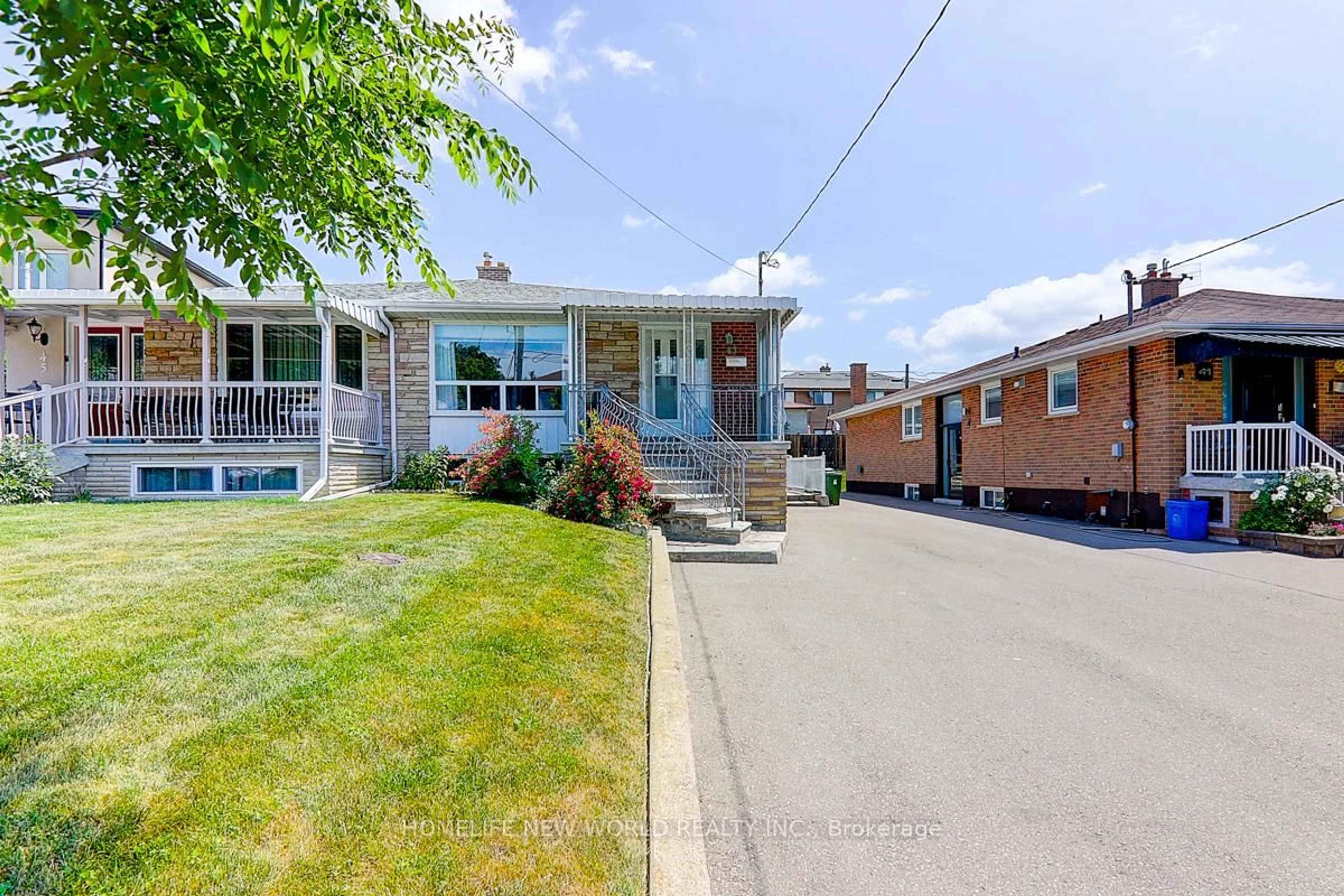 Home with brick exterior material, street for 43 Coquette Rd, Toronto Ontario M3L 1T1