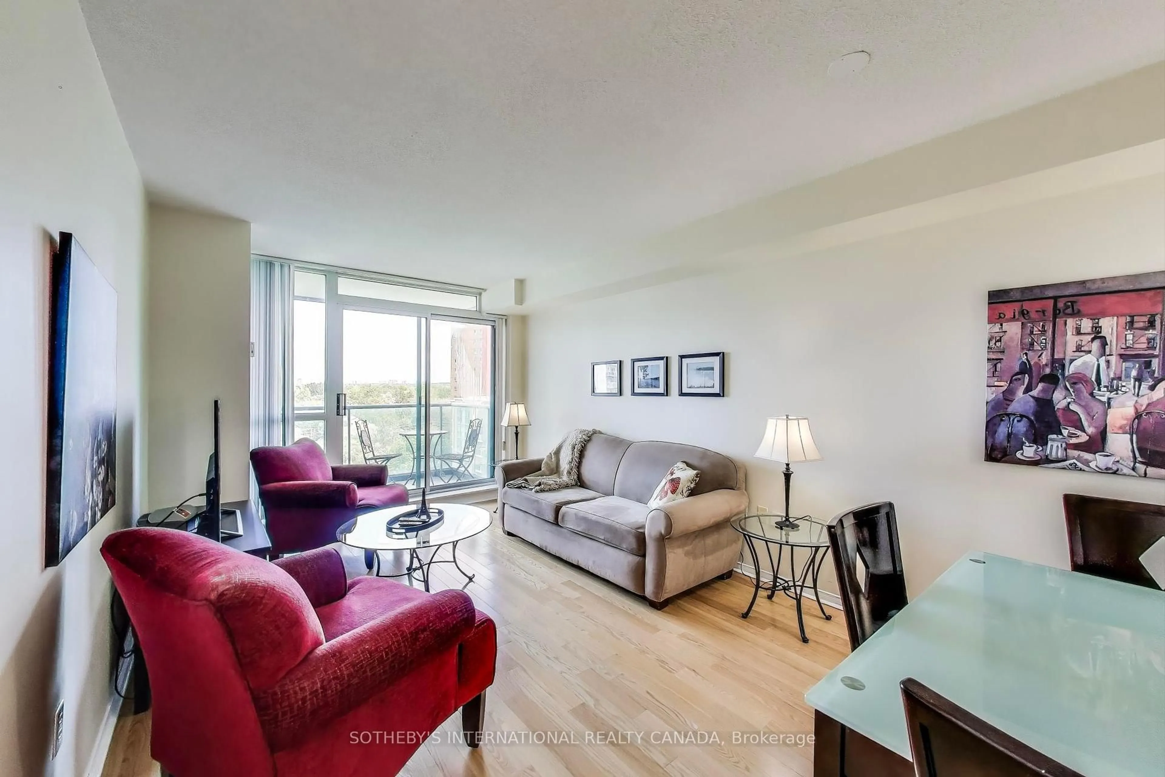 Living room with furniture, wood/laminate floor for 11 Michael Power Pl #1111, Toronto Ontario M9A 5G3