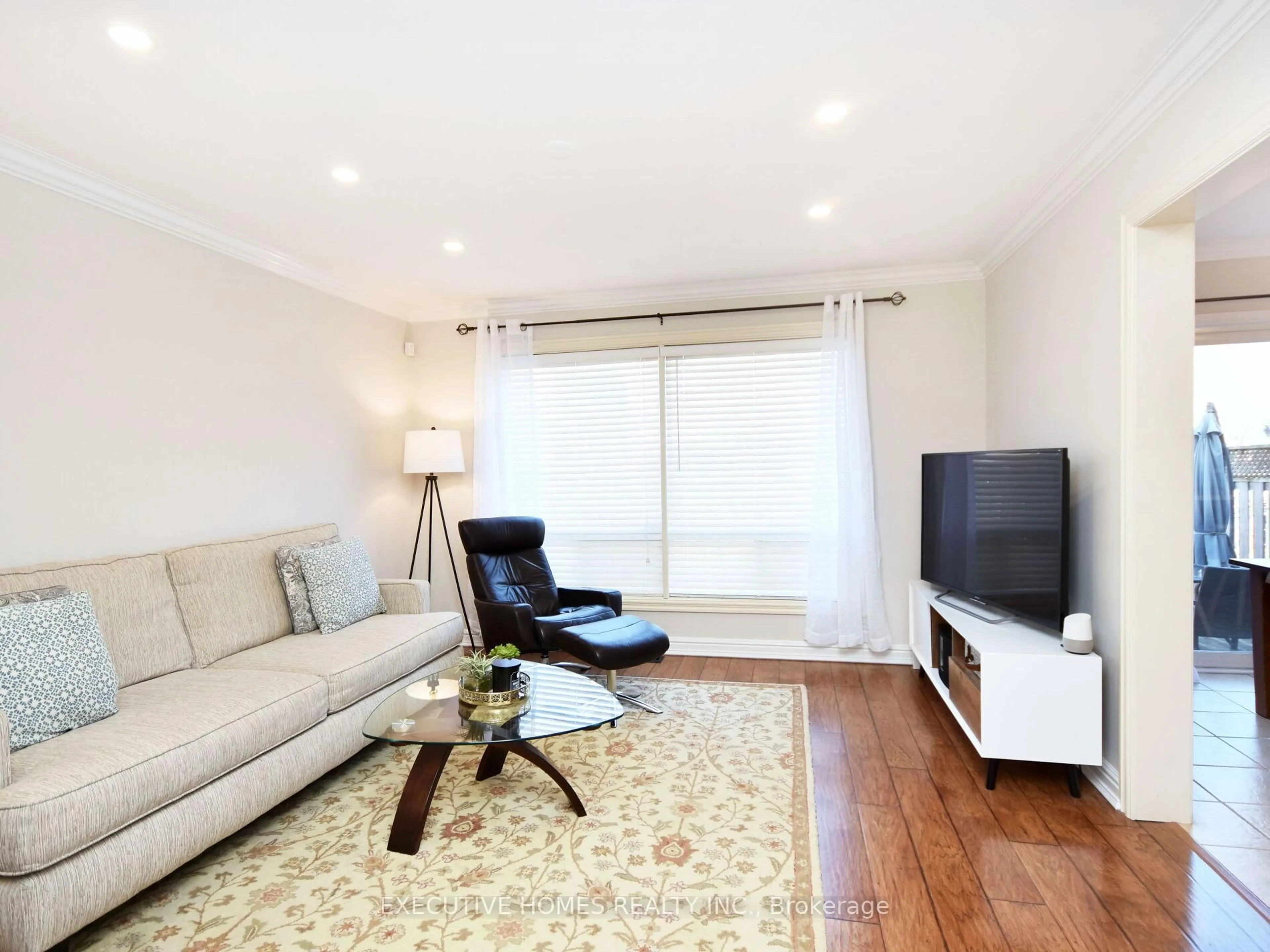 Living room with furniture, wood/laminate floor for 1058 Bowring Cres, Milton Ontario L9T 6H4