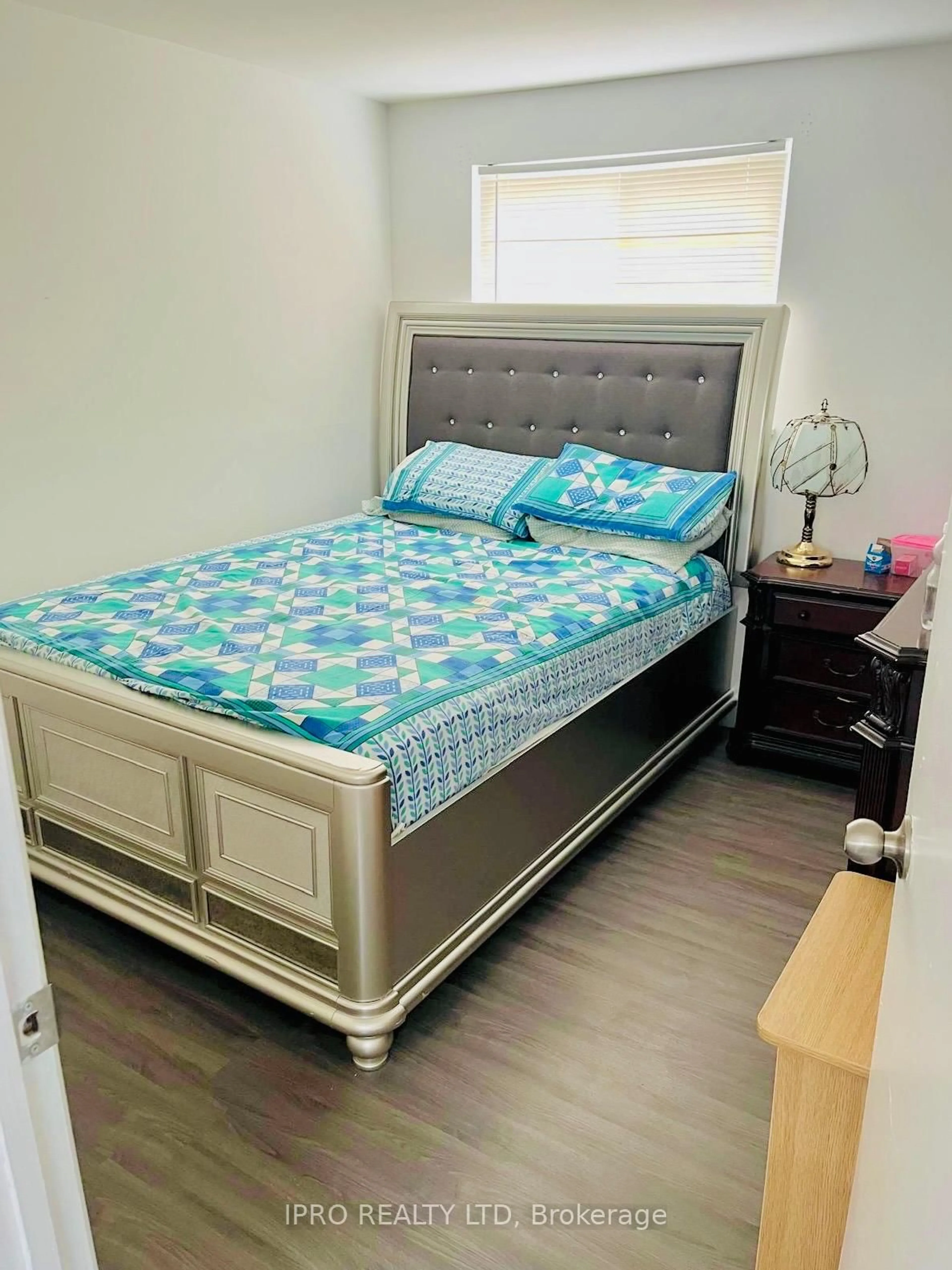 Bedroom with bed, wood/laminate floor for 38 Tindale Rd, Brampton Ontario L6V 2G9