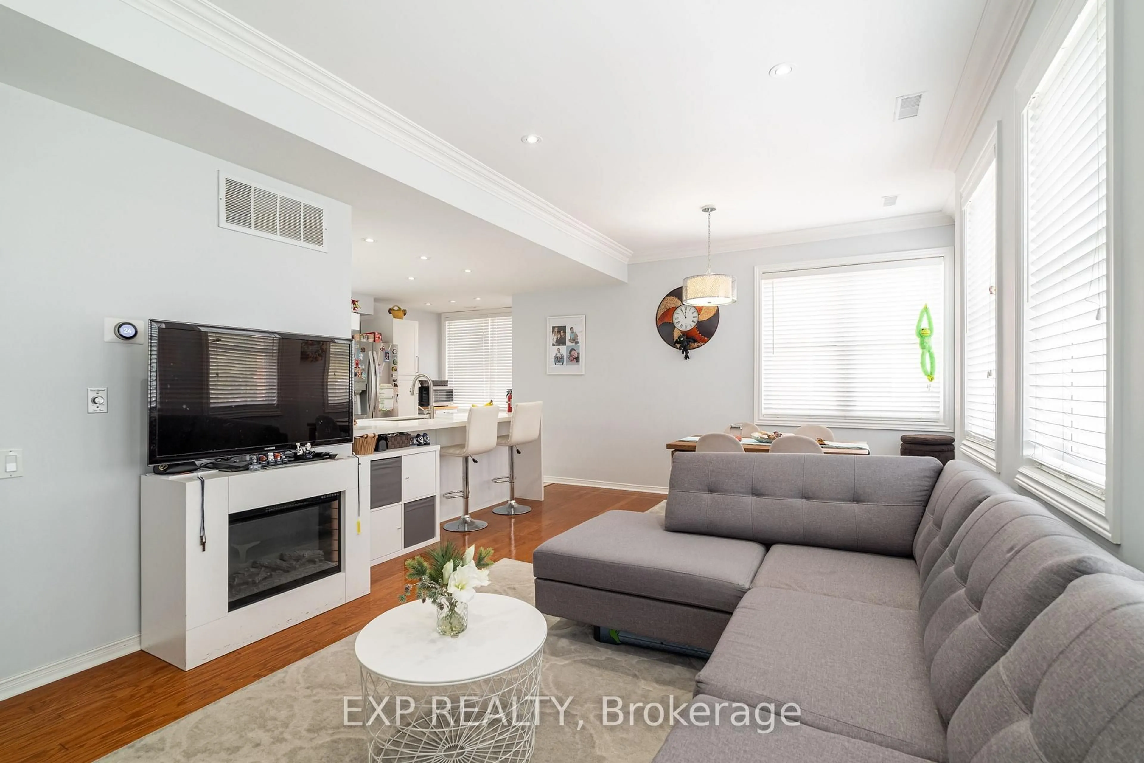 Living room with furniture, wood/laminate floor for 760 Lawrence Ave #TH 221, Toronto Ontario M6A 1B8