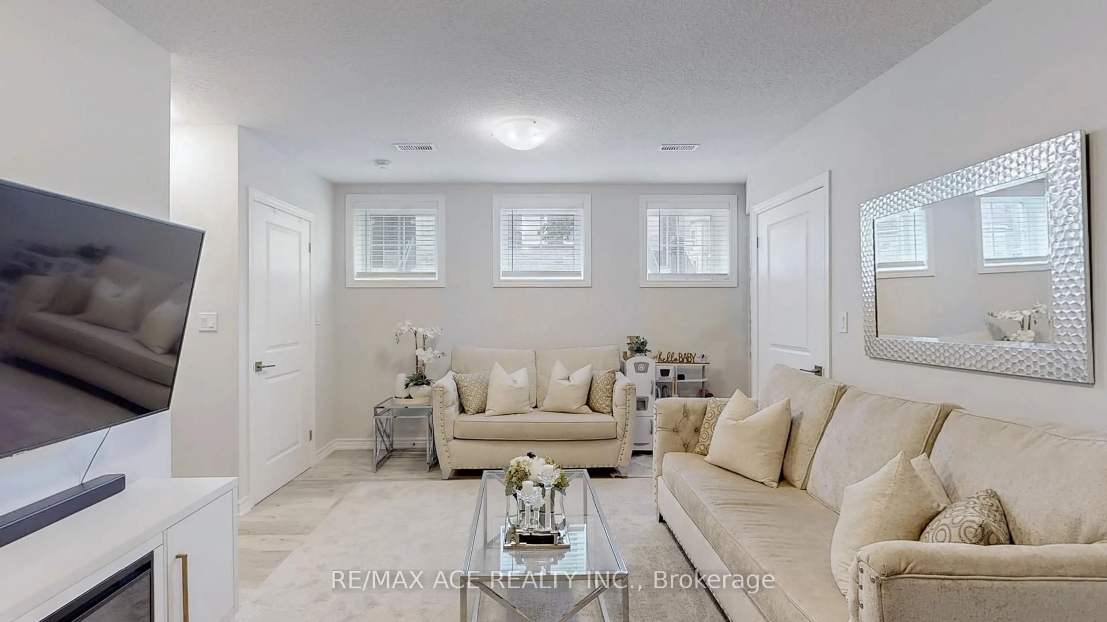 Living room with furniture, ceramic/tile floor for 445 Ontario St #120, Milton Ontario L9T 9K5