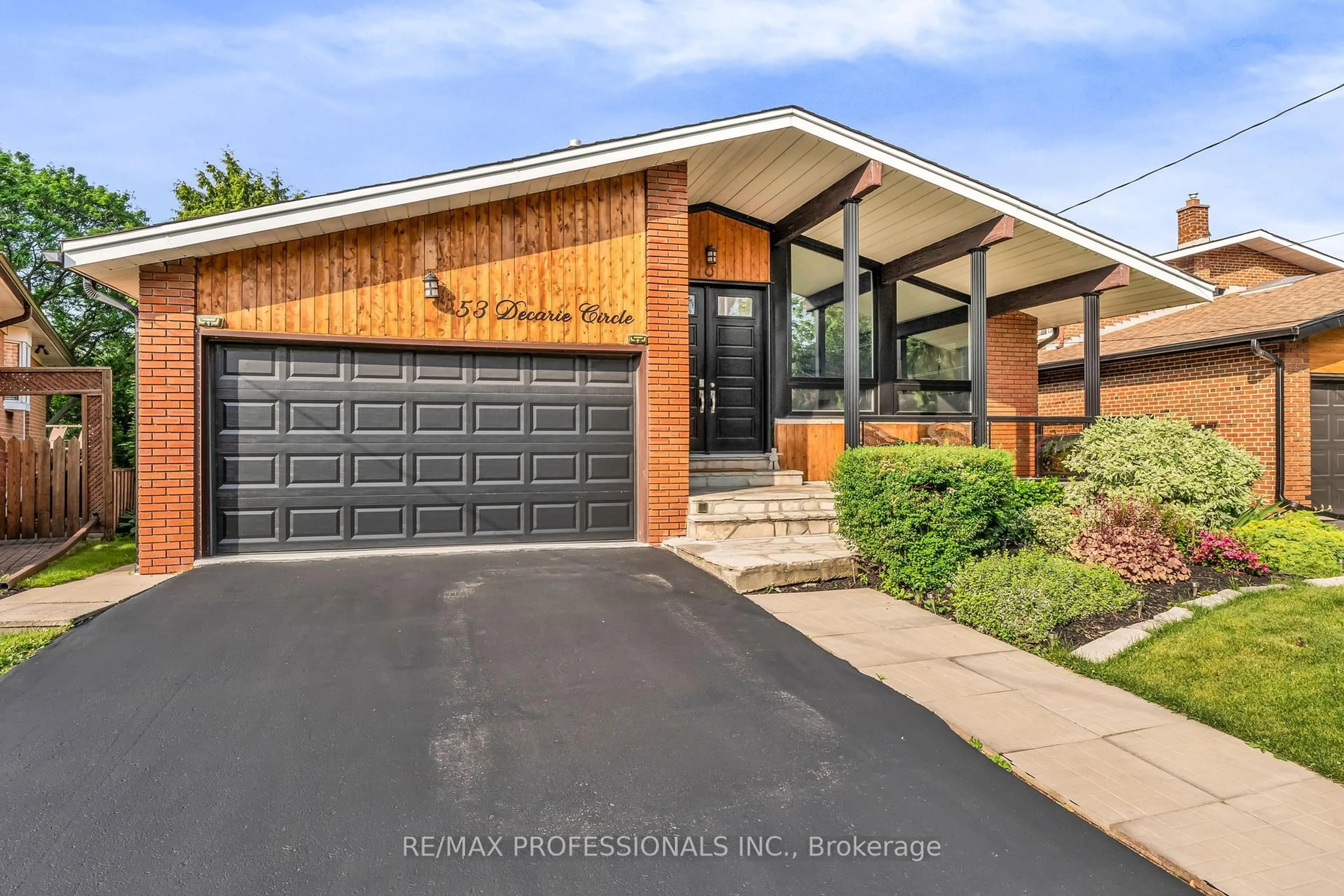 Home with brick exterior material, street for 53 Decarie Circ, Toronto Ontario M9B 3J1