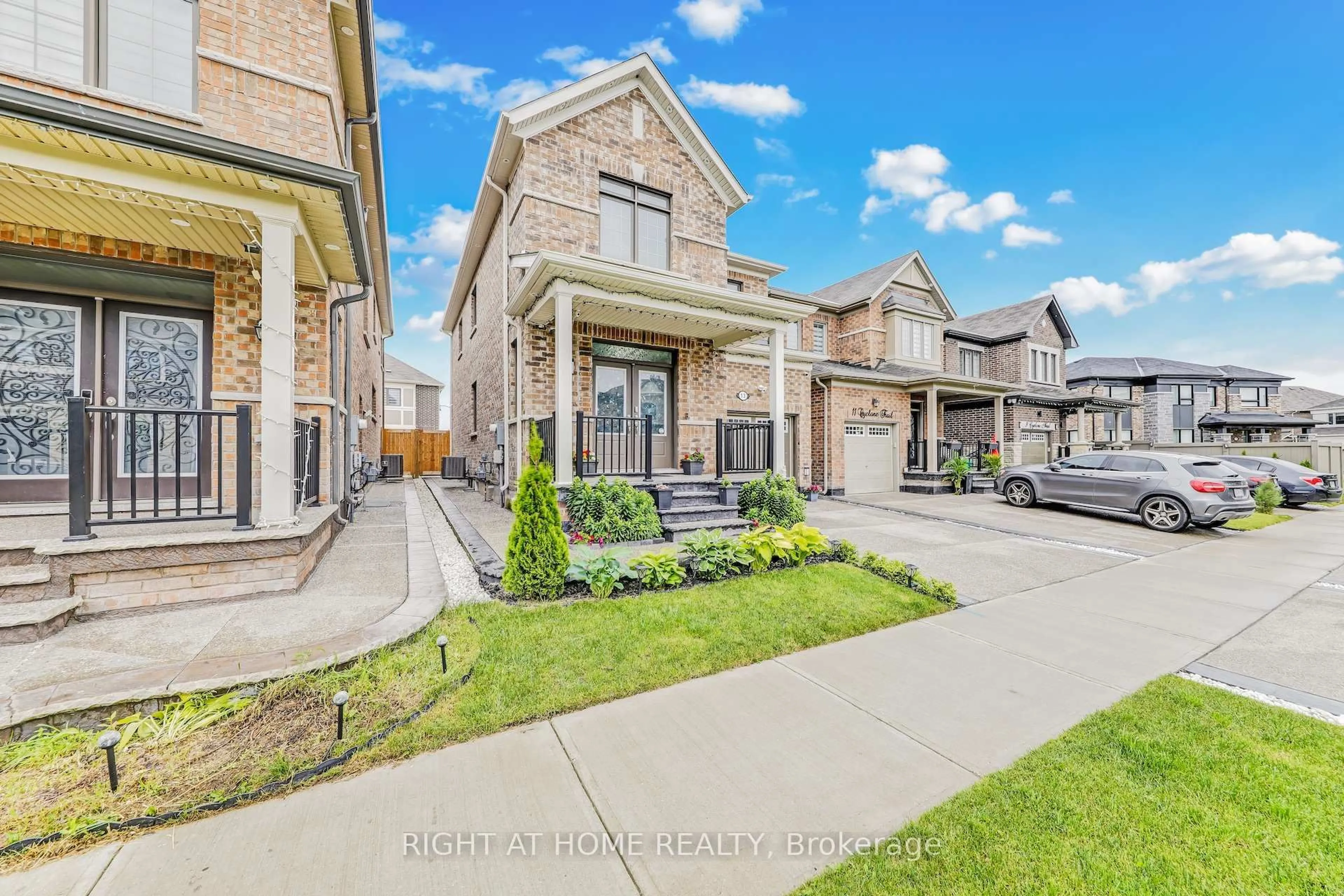 Home with brick exterior material, street for 13 Cyclone Tr, Brampton Ontario L7A 5E8