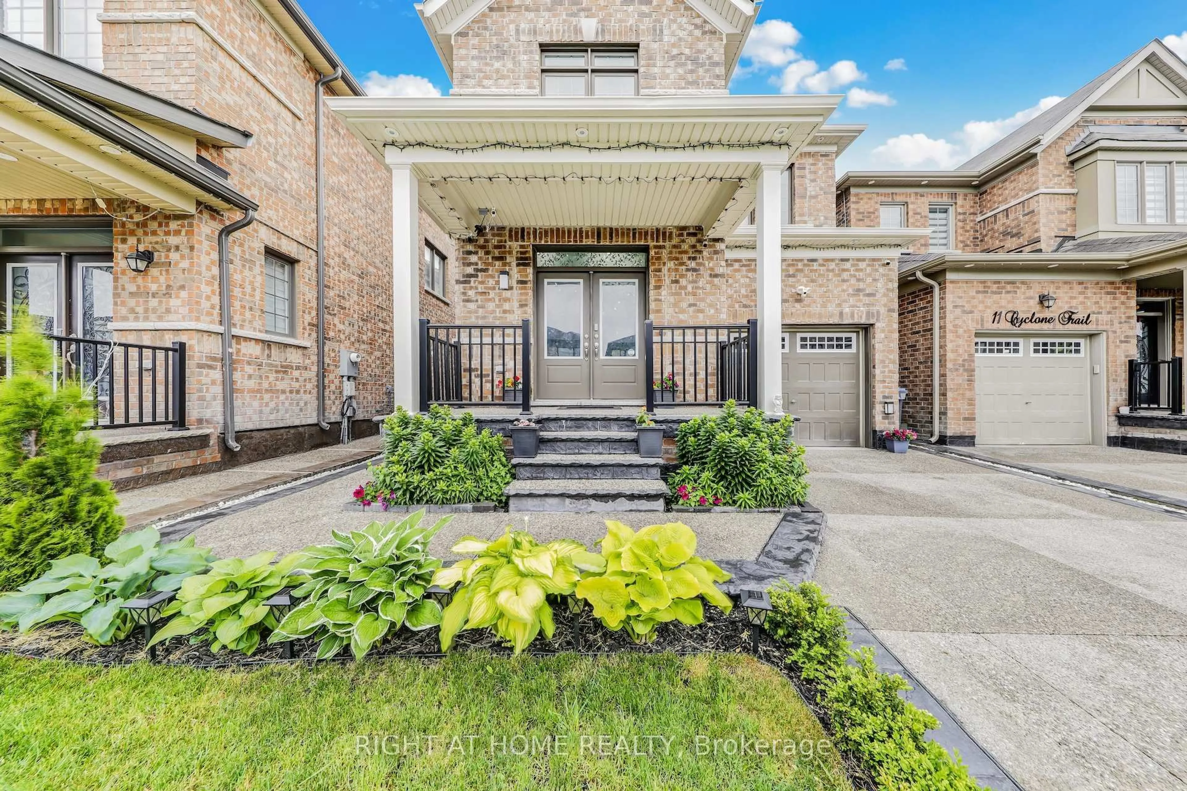 Home with brick exterior material, street for 13 Cyclone Tr, Brampton Ontario L7A 5E8