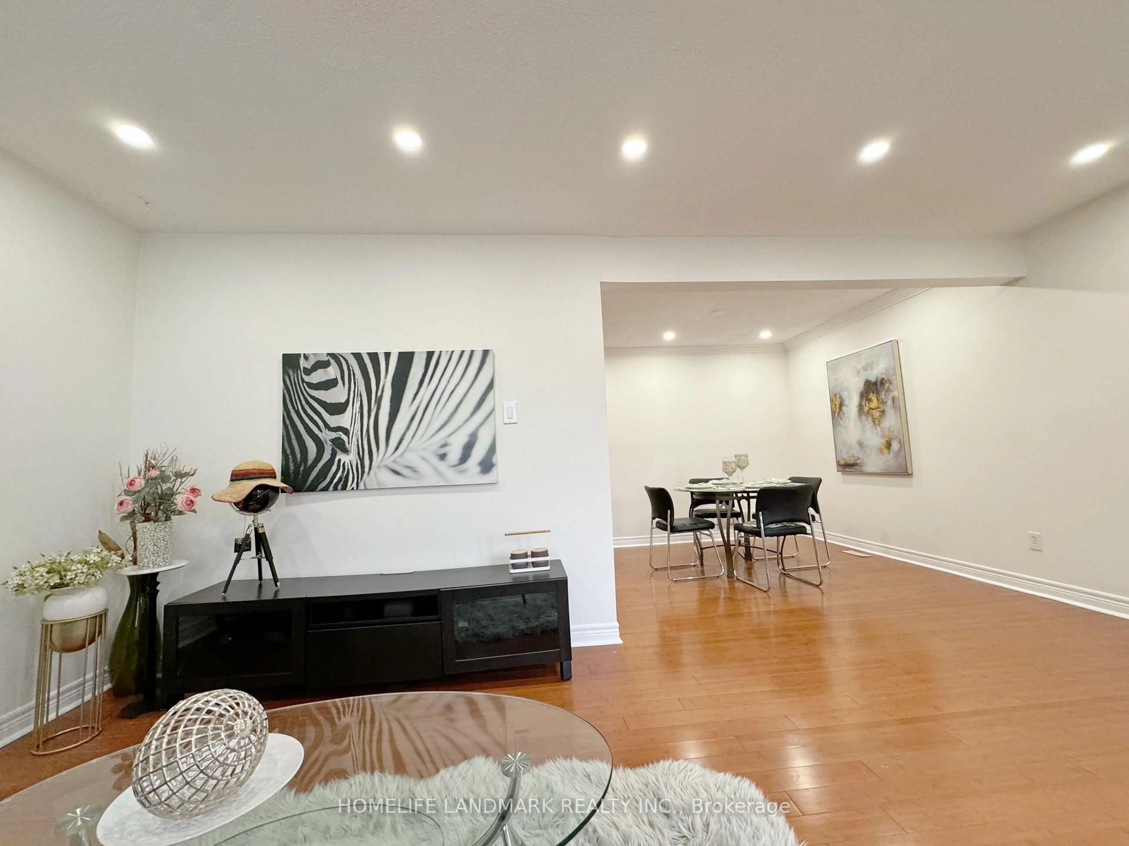 Living room with furniture, wood/laminate floor for 900 Central Park Dr #1, Brampton Ontario L6S 3J6
