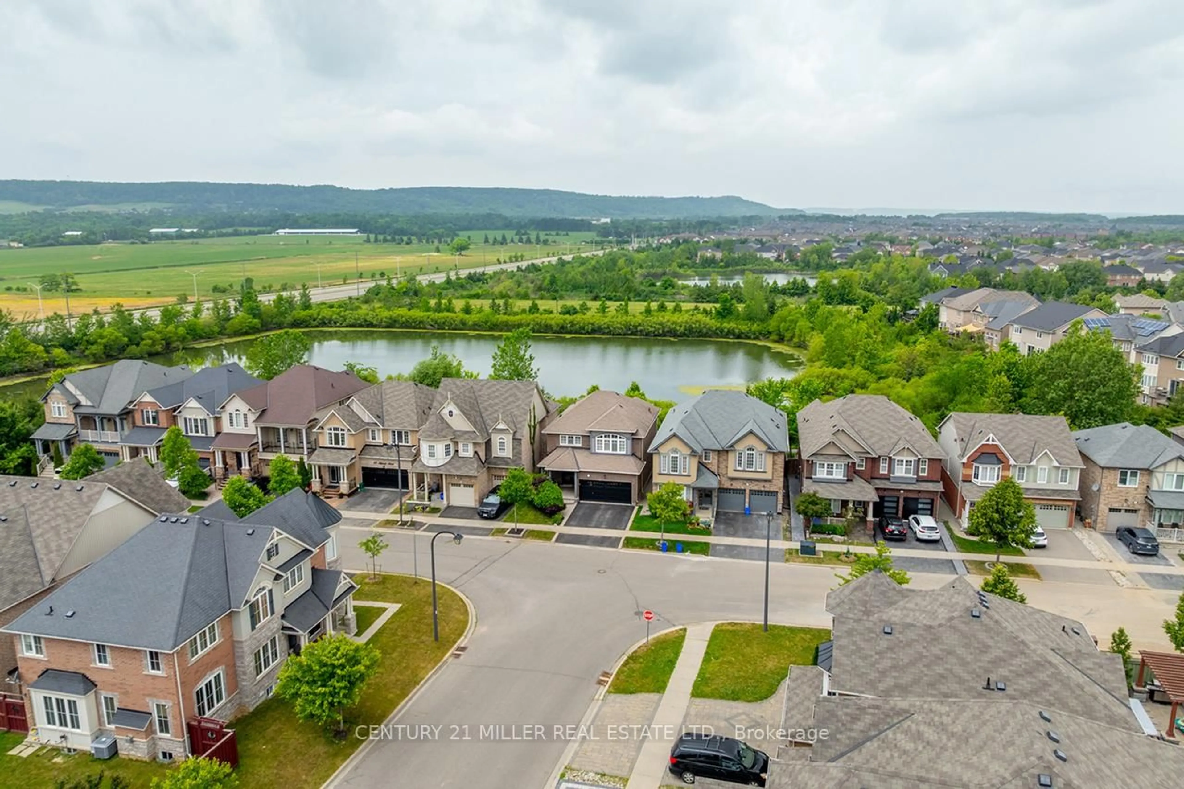 A pic from outside/outdoor area/front of a property/back of a property/a pic from drone, water/lake/river/ocean view for 411 McJannett Ave, Milton Ontario L9T 7T8