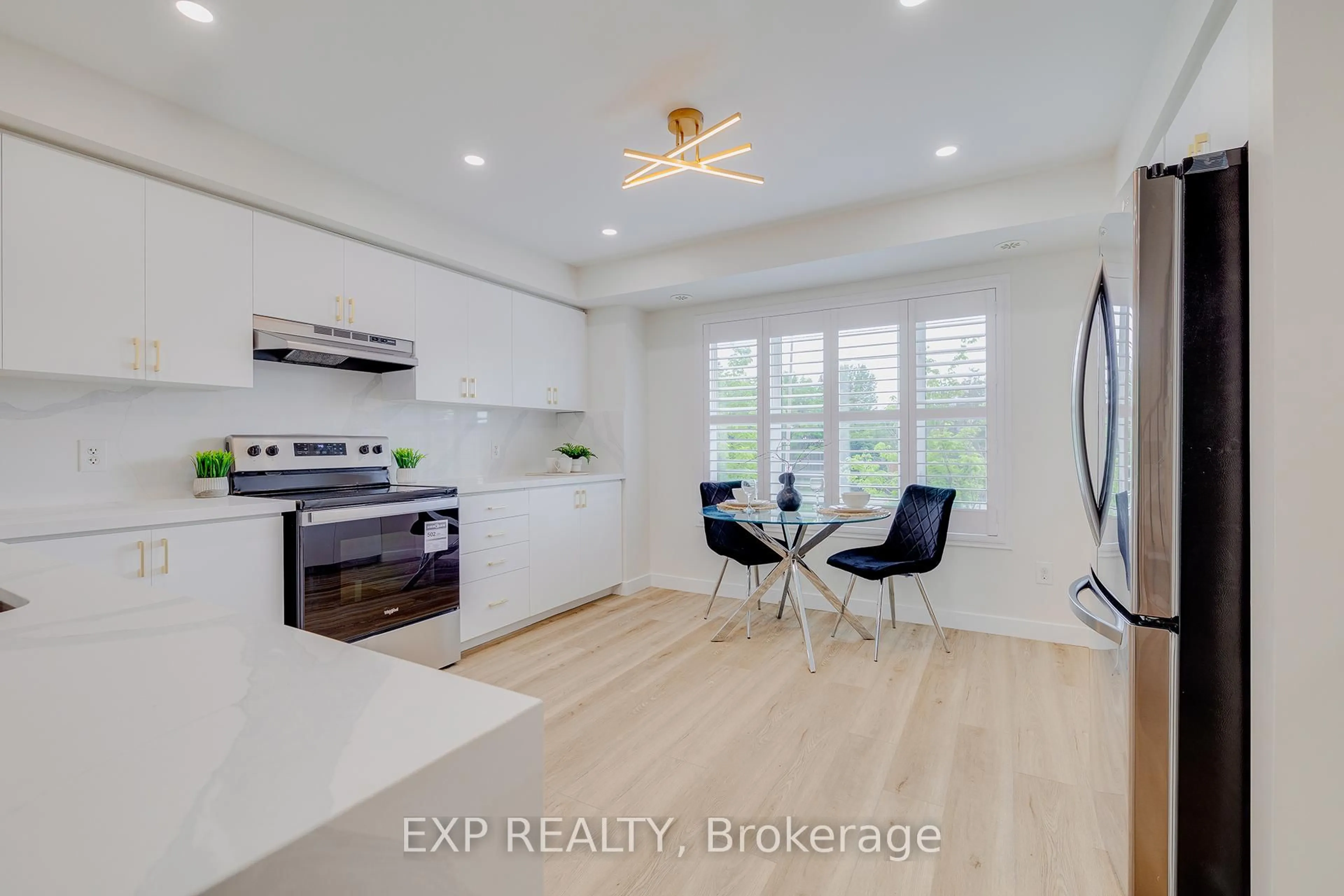 Open concept kitchen, wood/laminate floor for 5610 Winston Churchill Blvd #7, Mississauga Ontario L5M 0L9
