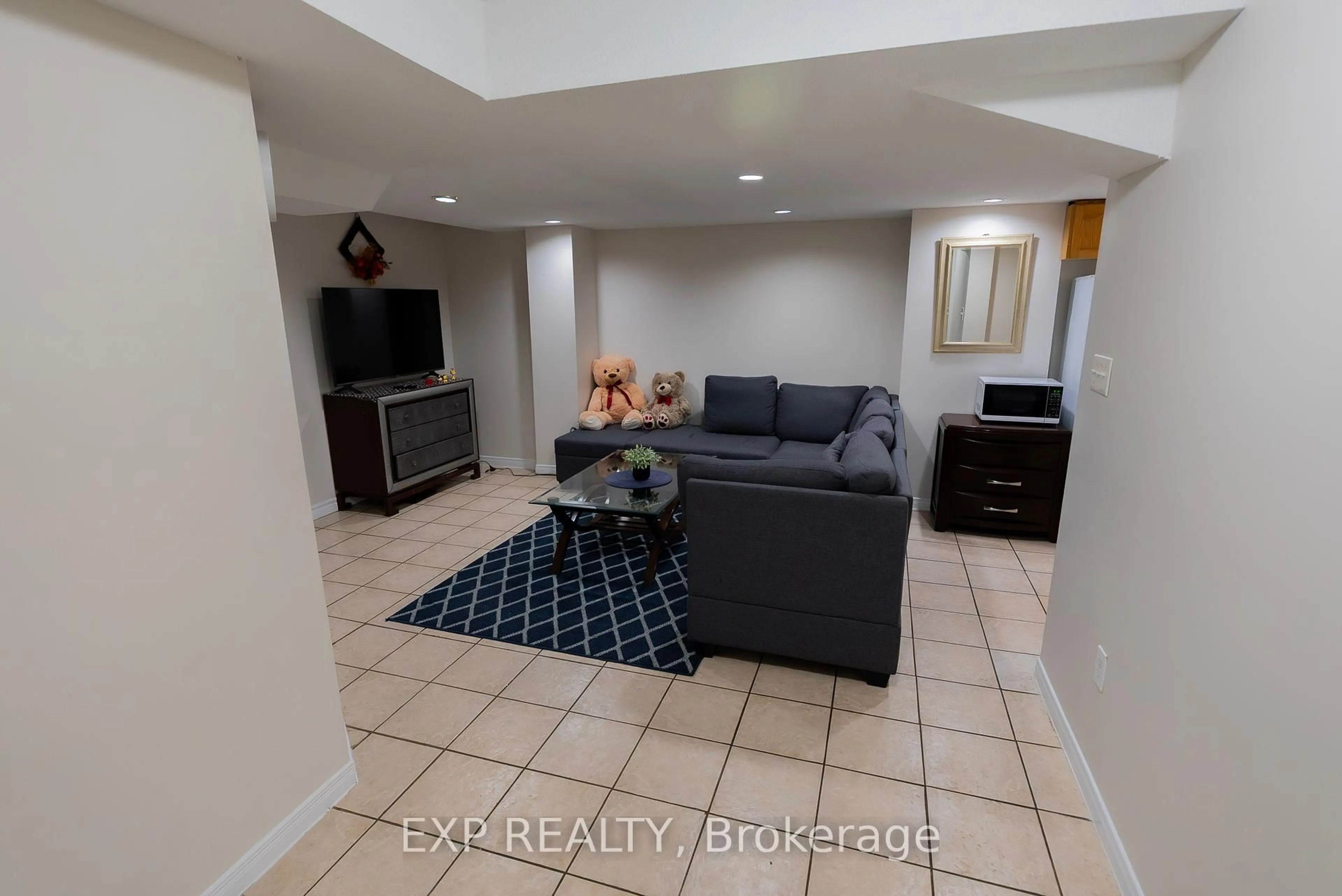 Living room with furniture, ceramic/tile floor for 347 Brisdale Dr, Brampton Ontario L7A 3M6