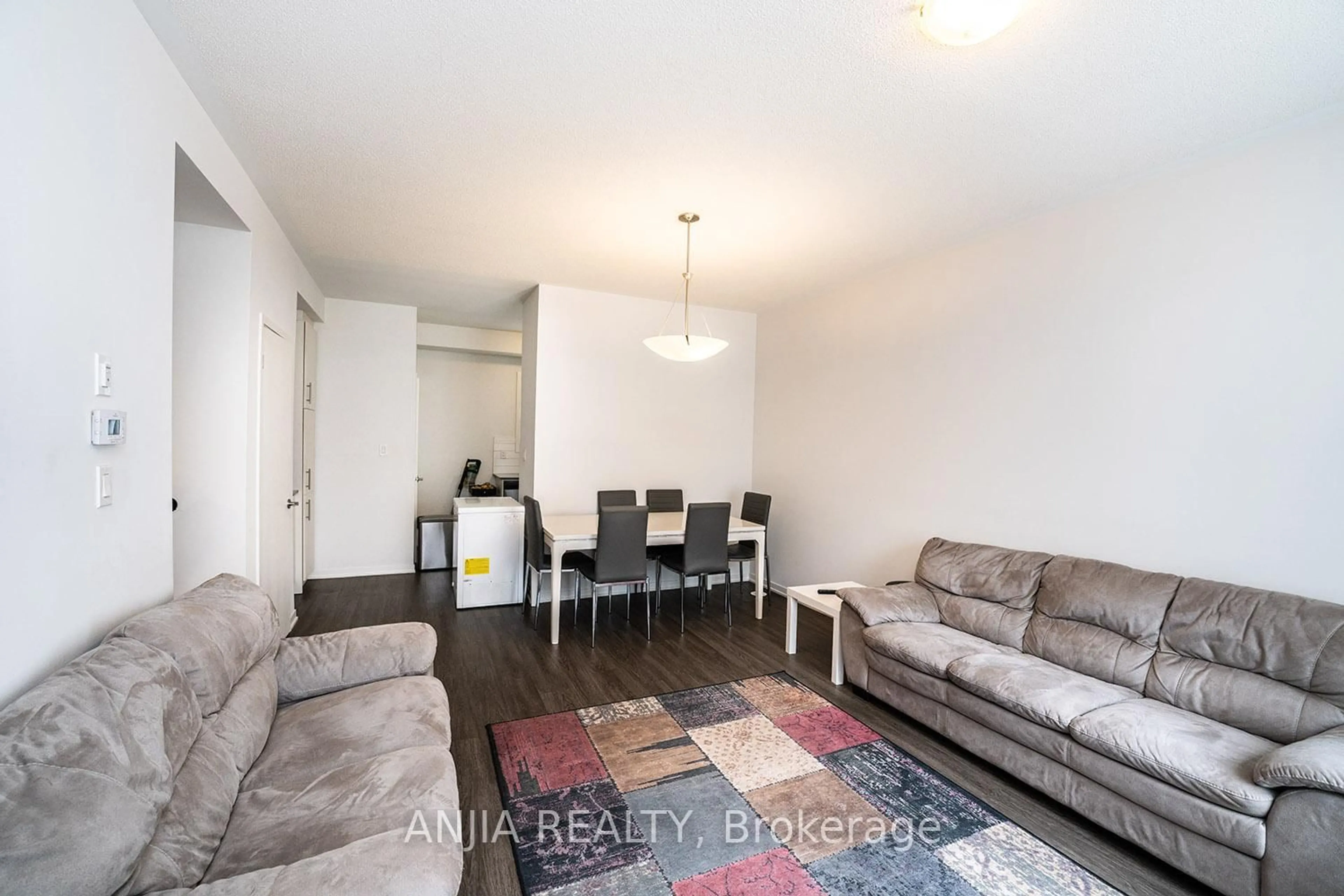 Living room with furniture, wood/laminate floor for 235 Birmingham St #139, Toronto Ontario M8V 0J5