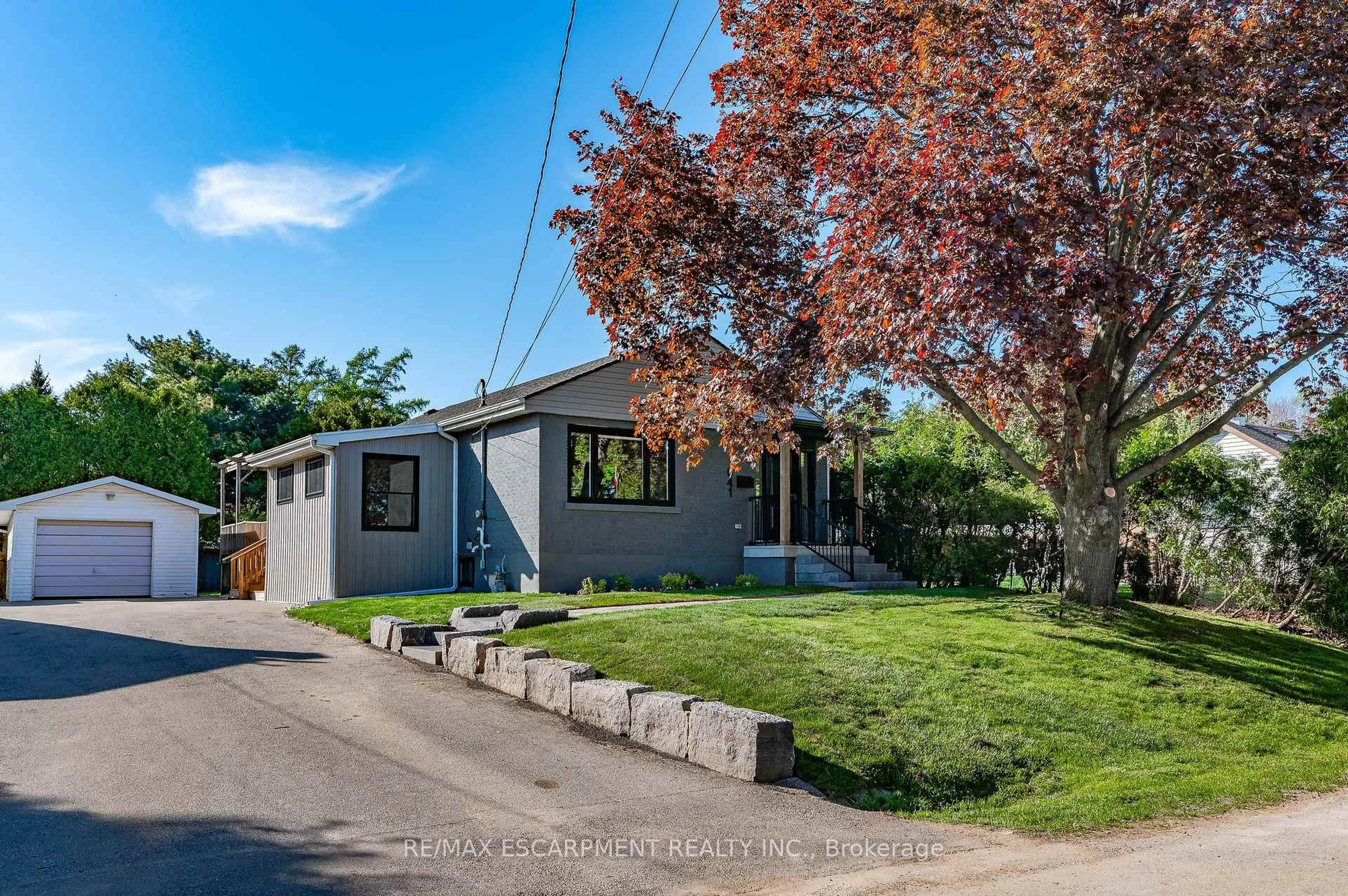 Home with vinyl exterior material, street for 1041 Shepherd's Dr, Burlington Ontario L7T 3R4