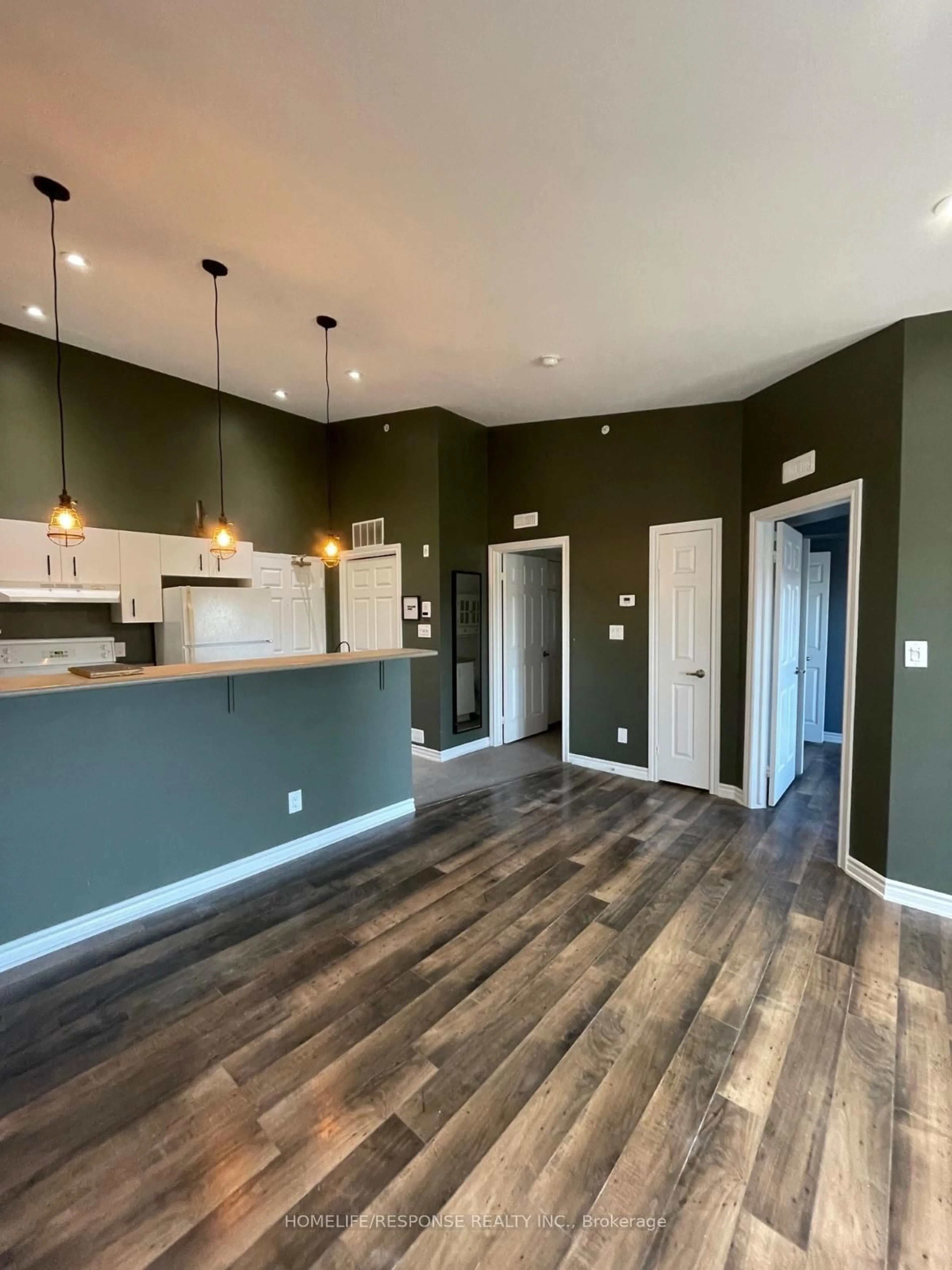 Open concept kitchen, wood/laminate floor for 1830 WALKER'S Line #403, Burlington Ontario L7M 4V5
