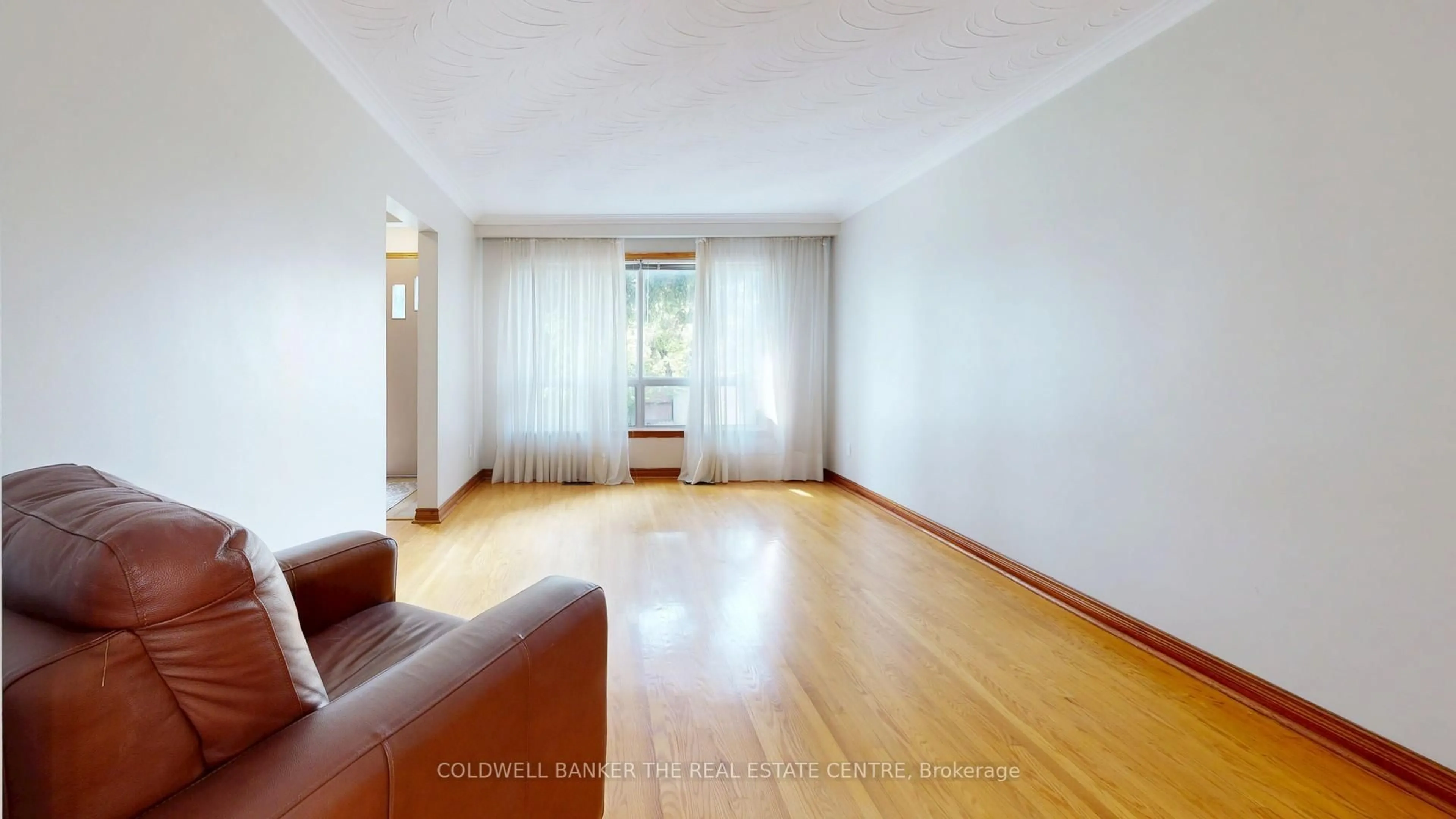 Living room with furniture, wood/laminate floor for 947 Saint Clarens Ave, Toronto Ontario M6H 3X8